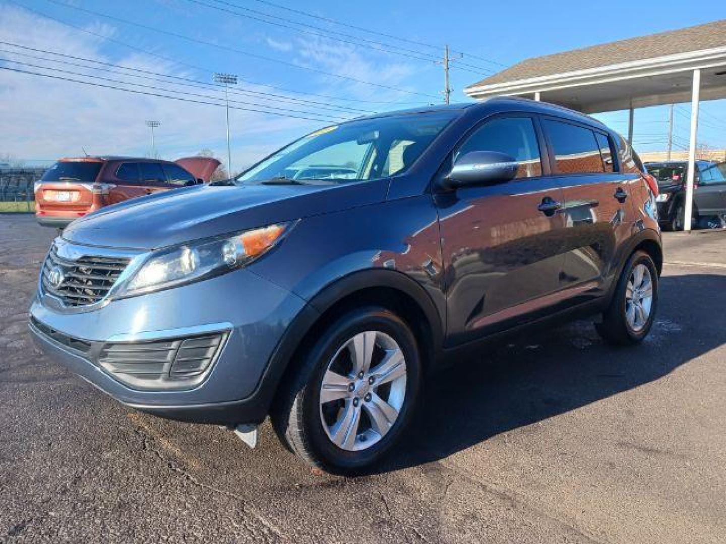 2013 Twilight Blue Kia Sportage LX FWD (KNDPB3A26D7) with an 2.4L V6 DOHC 24V engine, 6-Speed Automatic transmission, located at 1951 S Dayton Lakeview Rd., New Carlisle, OH, 45344, (937) 908-9800, 39.890999, -84.050255 - Photo#2