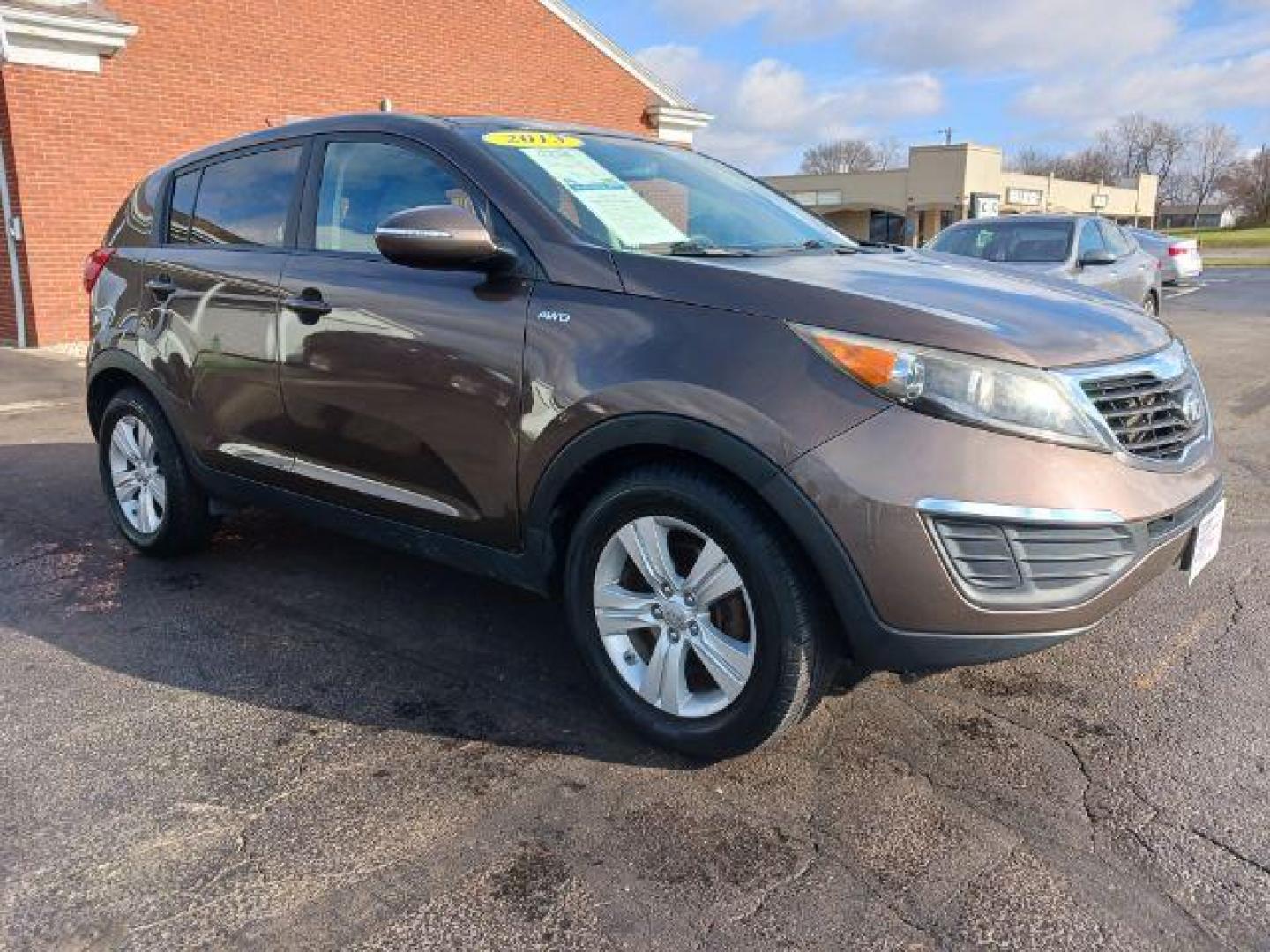 2013 Sand Track Kia Sportage LX AWD (KNDPBCA21D7) with an 2.4L V6 DOHC 24V engine, 6-Speed Automatic transmission, located at 880 E. National Road, Vandalia, OH, 45377, (937) 908-9800, 39.891918, -84.183594 - Photo#0