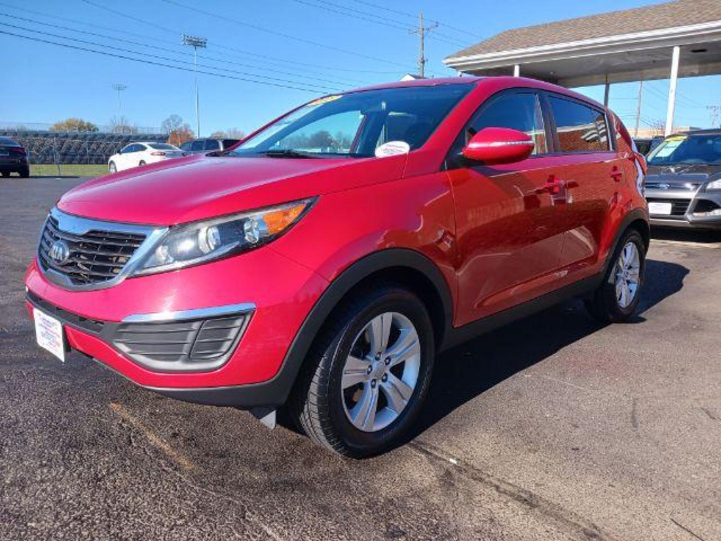 2013 Signal Red Kia Sportage LX FWD (KNDPB3A22D7) with an 2.4L V6 DOHC 24V engine, 6-Speed Automatic transmission, located at 1951 S Dayton Lakeview Rd., New Carlisle, OH, 45344, (937) 908-9800, 39.890999, -84.050255 - Photo#2