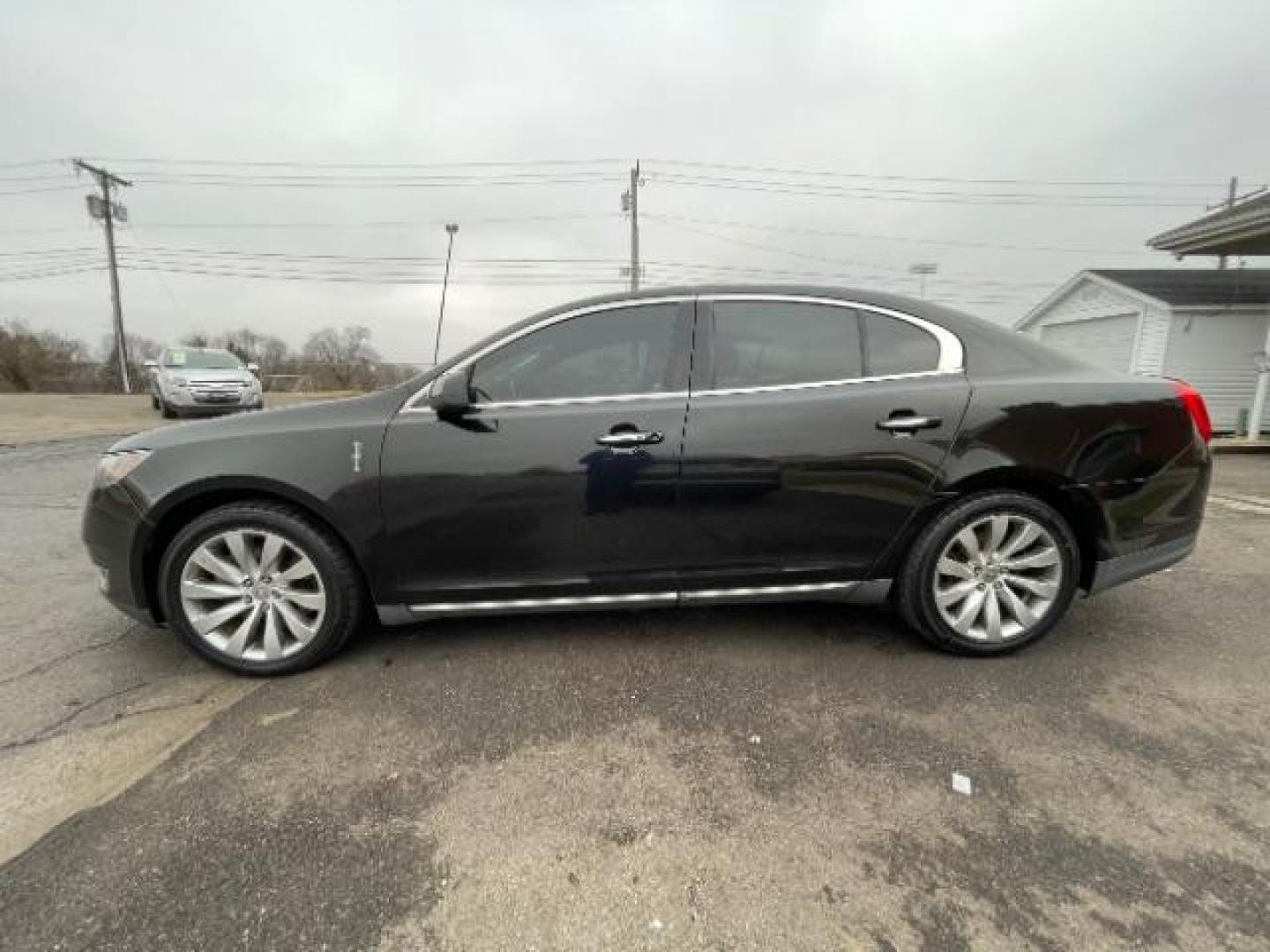 2013 Tuxedo Black Lincoln MKS FWD (1LNHL9DK0DG) with an 3.5L V6 DOHC 24V engine, 6-Speed Automatic transmission, located at 1230 East Main St, Xenia, OH, 45385, (937) 908-9800, 39.688026, -83.910172 - Photo#2