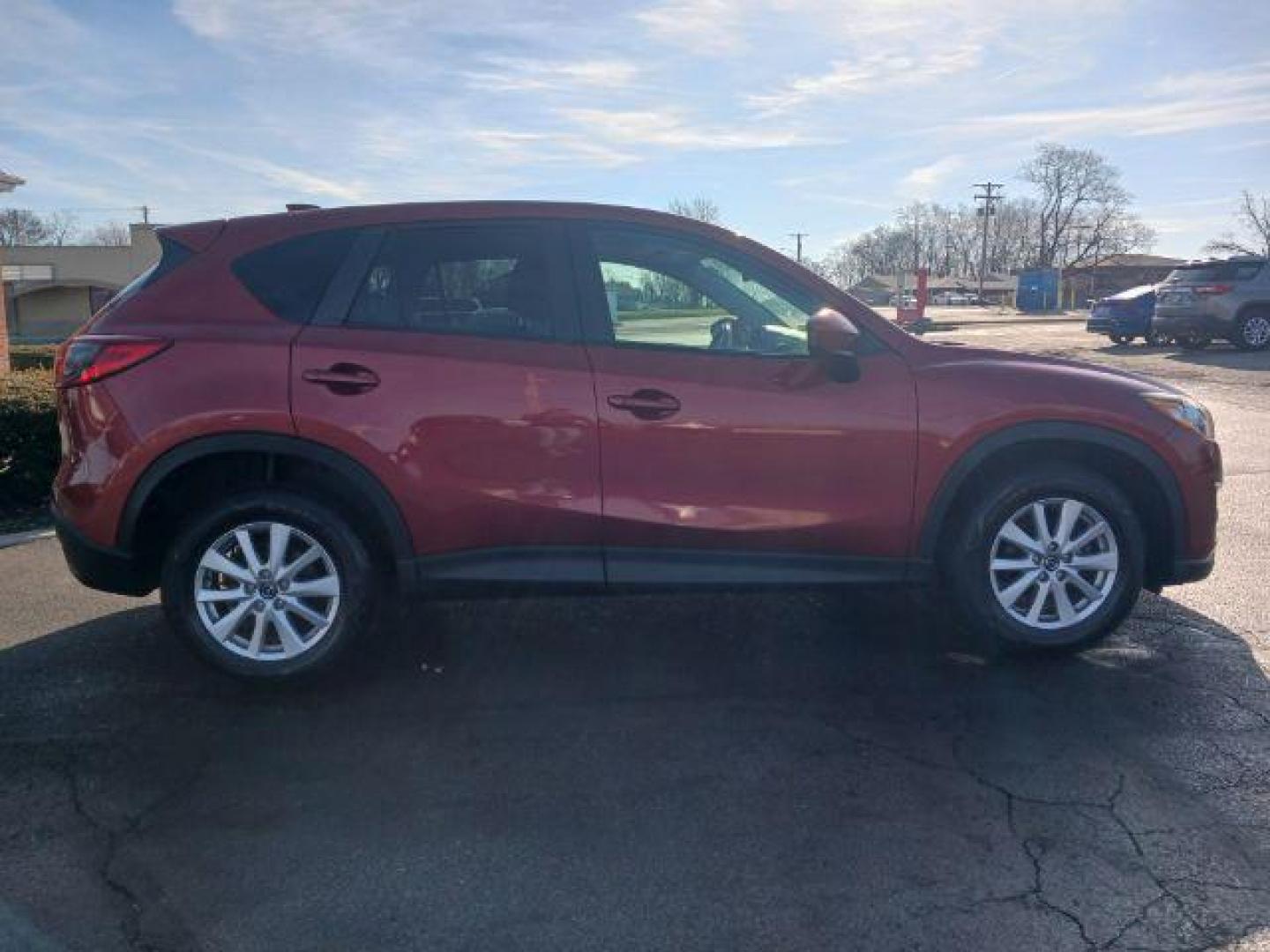 2013 Red Mazda CX-5 Touring AWD (JM3KE4CE4D0) with an 2.0L L4 DOHC 16V engine, 6-Speed Automatic transmission, located at 401 Woodman Dr, Riverside, OH, 45431, (937) 908-9800, 39.760899, -84.123421 - Photo#4