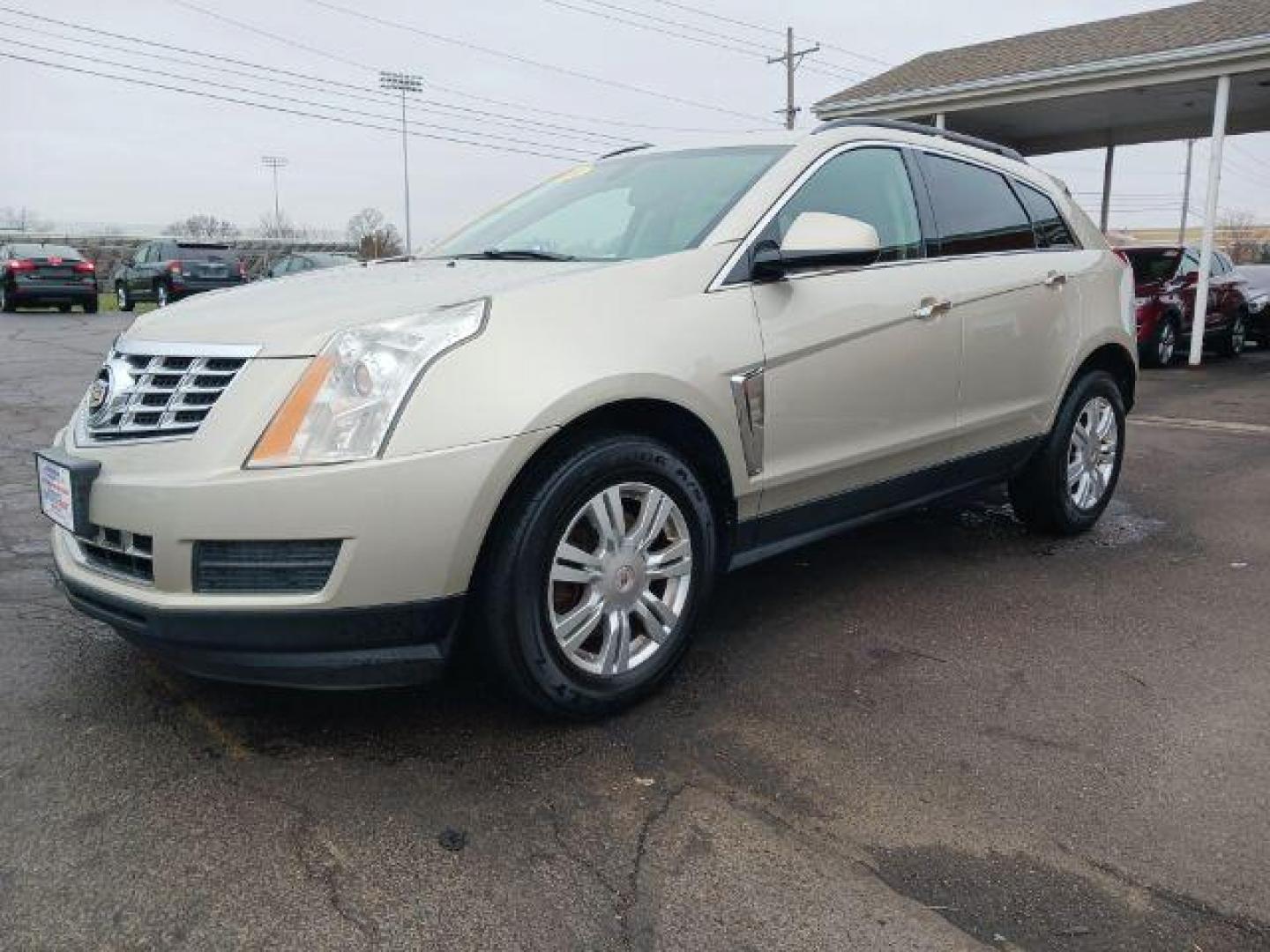 2014 Terra Mocha Metallic Cadillac SRX Standard FWD (3GYFNAE3XES) with an 3.6L V6 DOHC 24V FFV engine, 6-Speed Automatic transmission, located at 401 Woodman Dr, Riverside, OH, 45431, (937) 908-9800, 39.760899, -84.123421 - Photo#2