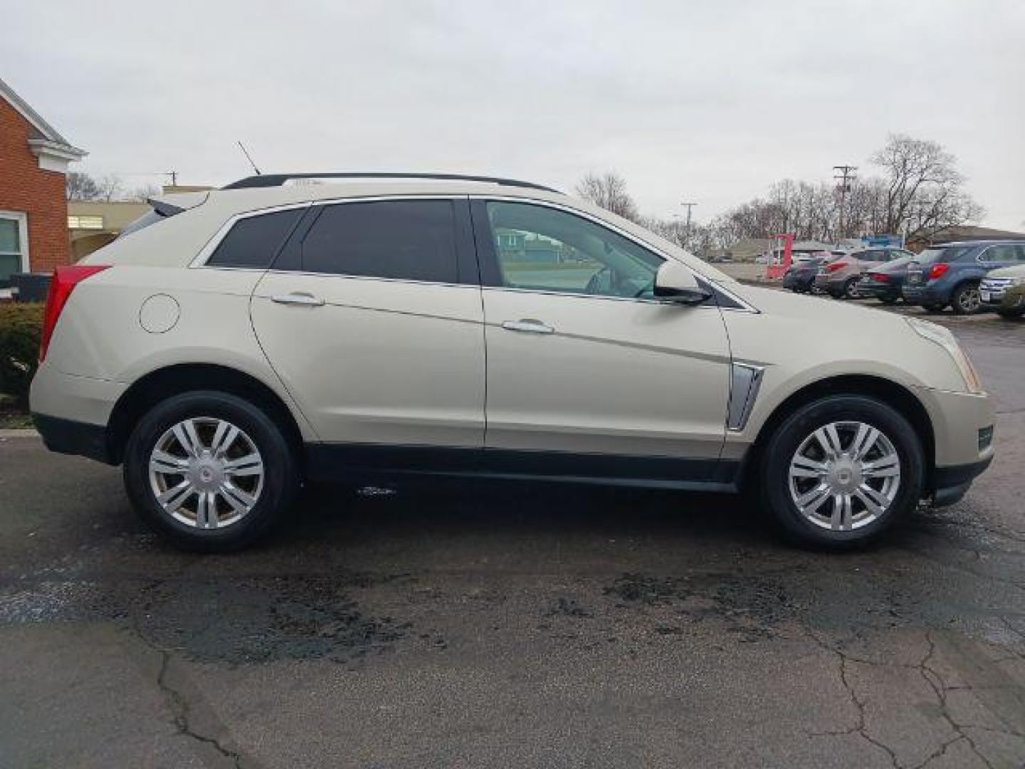 2014 Terra Mocha Metallic Cadillac SRX Standard FWD (3GYFNAE3XES) with an 3.6L V6 DOHC 24V FFV engine, 6-Speed Automatic transmission, located at 401 Woodman Dr, Riverside, OH, 45431, (937) 908-9800, 39.760899, -84.123421 - Photo#4