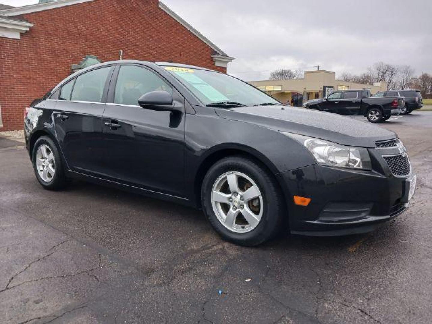 2014 Black Granite Metallic Chevrolet Cruze 1LT Auto (1G1PC5SB4E7) with an 1.4L L4 DOHC 16V TURBO engine, 6-Speed Automatic transmission, located at 4508 South Dixie Dr, Moraine, OH, 45439, (937) 908-9800, 39.689976, -84.218452 - Photo#0