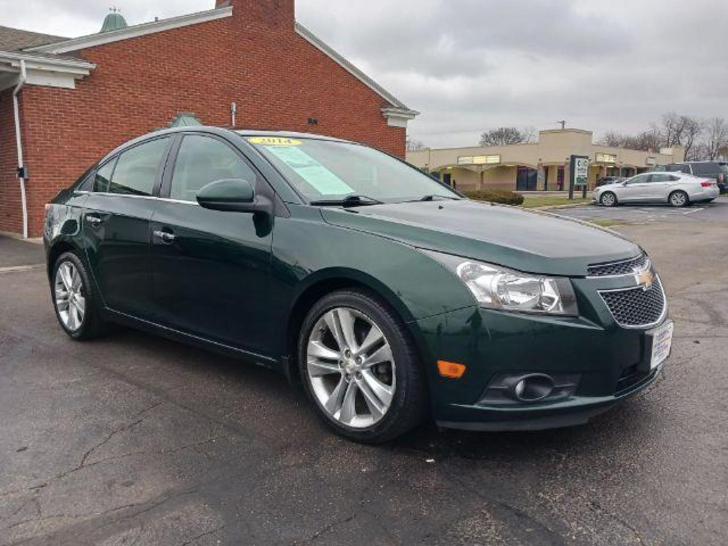 2014 Rainforest Green Metallic Chevrolet Cruze LTZ Auto (1G1PG5SB9E7) with an 1.4L L4 DOHC 16V TURBO engine, 6-Speed Automatic transmission, located at 1099 N County Rd 25A, Troy, OH, 45373, (937) 908-9800, 40.057079, -84.212883 - Photo#0