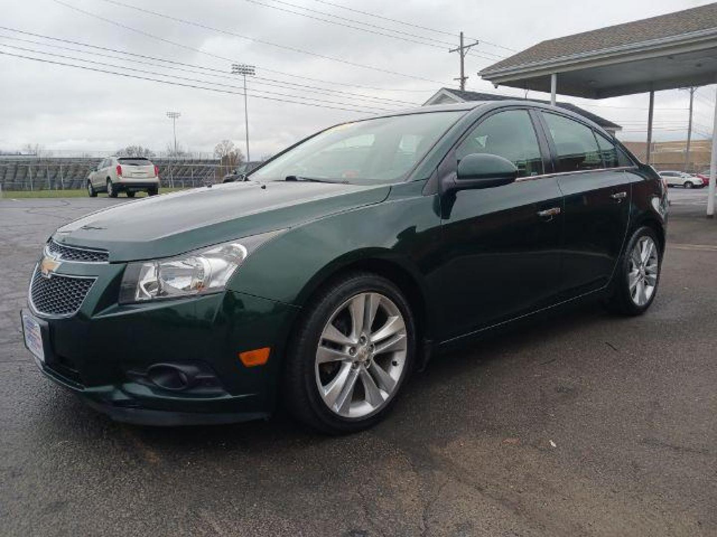 2014 Rainforest Green Metallic Chevrolet Cruze LTZ Auto (1G1PG5SB9E7) with an 1.4L L4 DOHC 16V TURBO engine, 6-Speed Automatic transmission, located at 1099 N County Rd 25A, Troy, OH, 45373, (937) 908-9800, 40.057079, -84.212883 - Photo#2