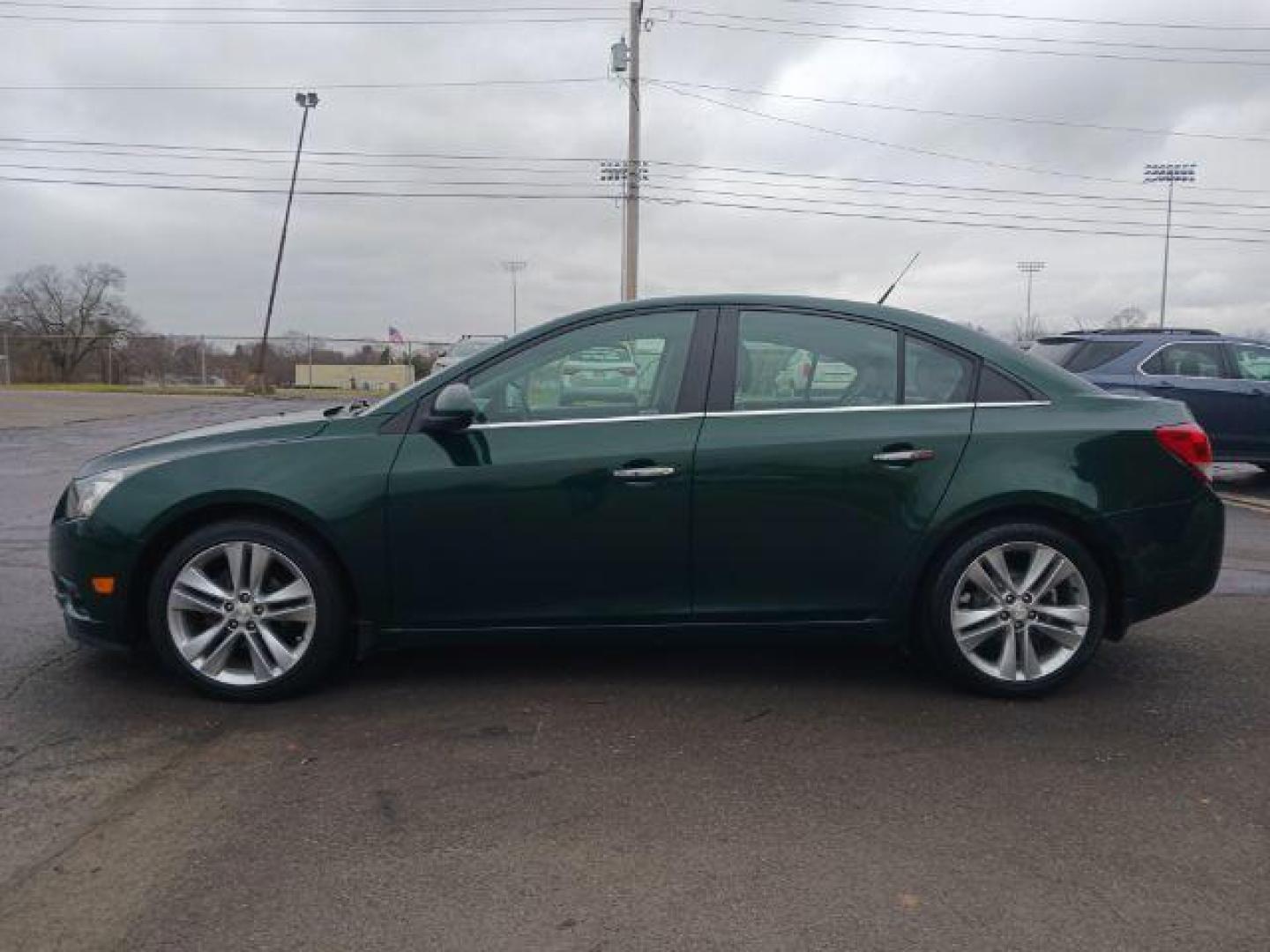 2014 Rainforest Green Metallic Chevrolet Cruze LTZ Auto (1G1PG5SB9E7) with an 1.4L L4 DOHC 16V TURBO engine, 6-Speed Automatic transmission, located at 1099 N County Rd 25A, Troy, OH, 45373, (937) 908-9800, 40.057079, -84.212883 - Photo#3