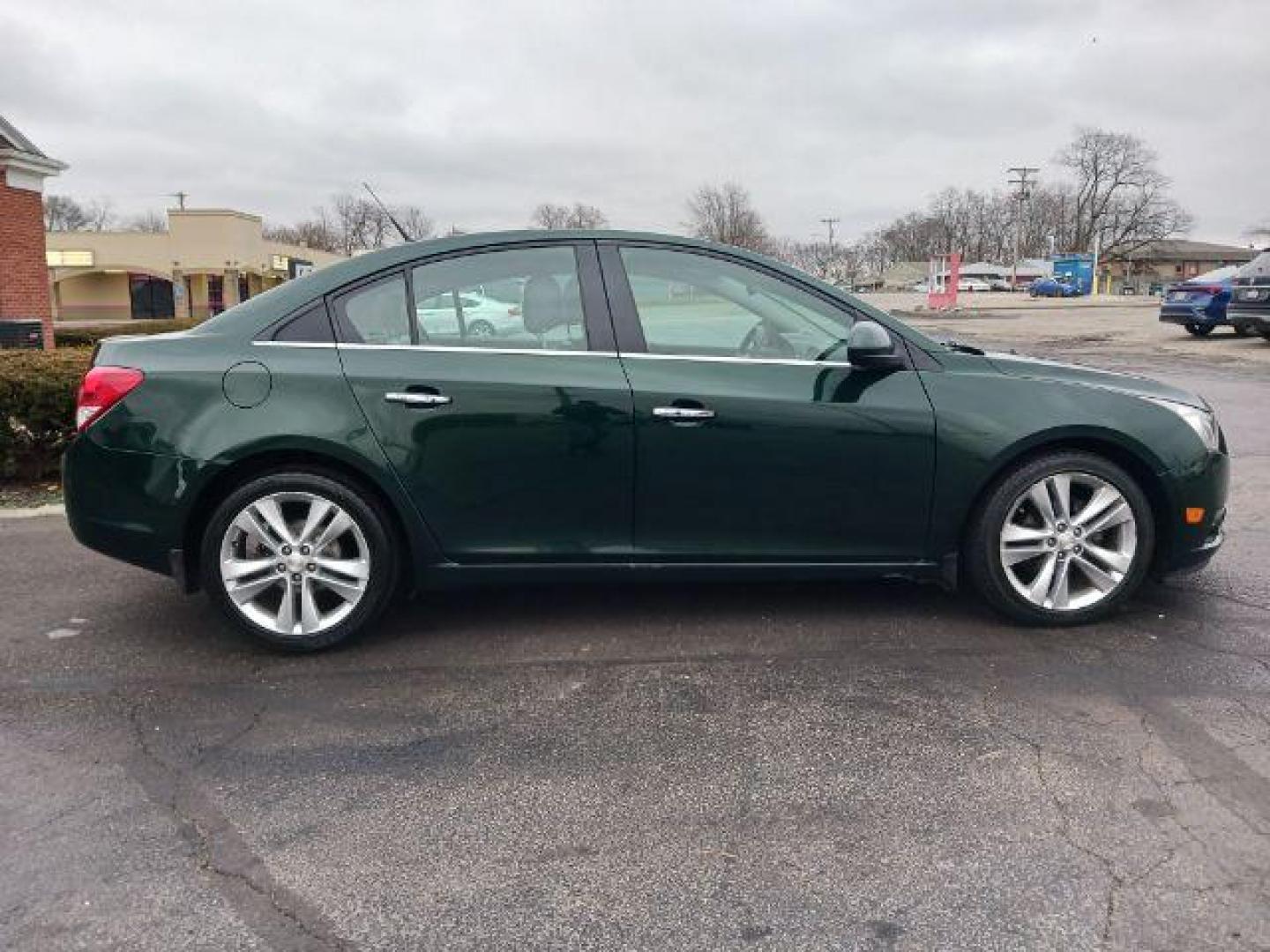 2014 Rainforest Green Metallic Chevrolet Cruze LTZ Auto (1G1PG5SB9E7) with an 1.4L L4 DOHC 16V TURBO engine, 6-Speed Automatic transmission, located at 1099 N County Rd 25A, Troy, OH, 45373, (937) 908-9800, 40.057079, -84.212883 - Photo#4