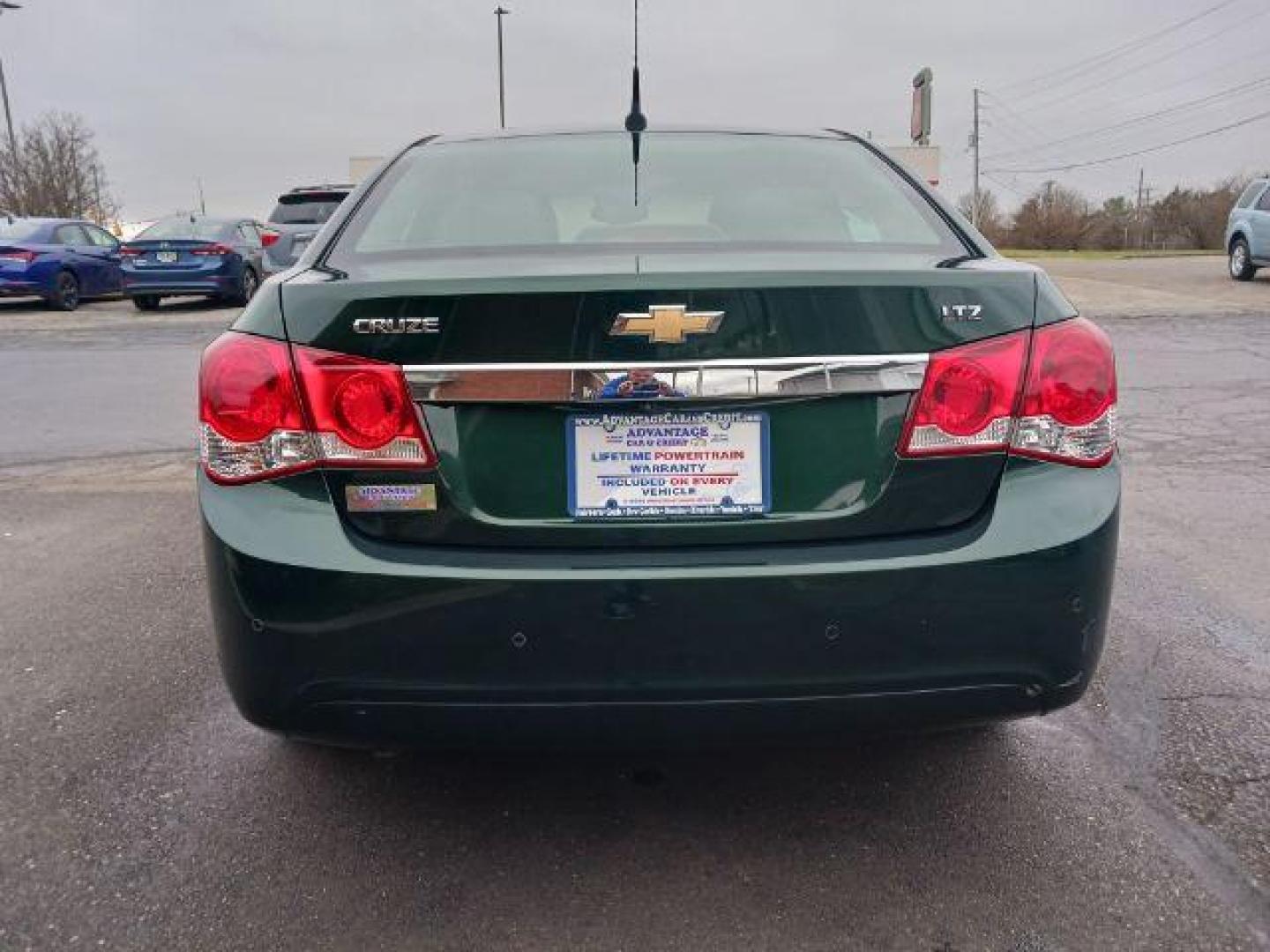 2014 Rainforest Green Metallic Chevrolet Cruze LTZ Auto (1G1PG5SB9E7) with an 1.4L L4 DOHC 16V TURBO engine, 6-Speed Automatic transmission, located at 1099 N County Rd 25A, Troy, OH, 45373, (937) 908-9800, 40.057079, -84.212883 - Photo#5