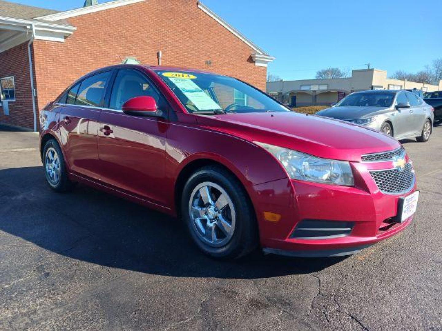 2014 Red Hot Chevrolet Cruze 1LT Auto (1G1PC5SB2E7) with an 1.4L L4 DOHC 16V TURBO engine, 6-Speed Automatic transmission, located at 4508 South Dixie Dr, Moraine, OH, 45439, (937) 908-9800, 39.689976, -84.218452 - Photo#0