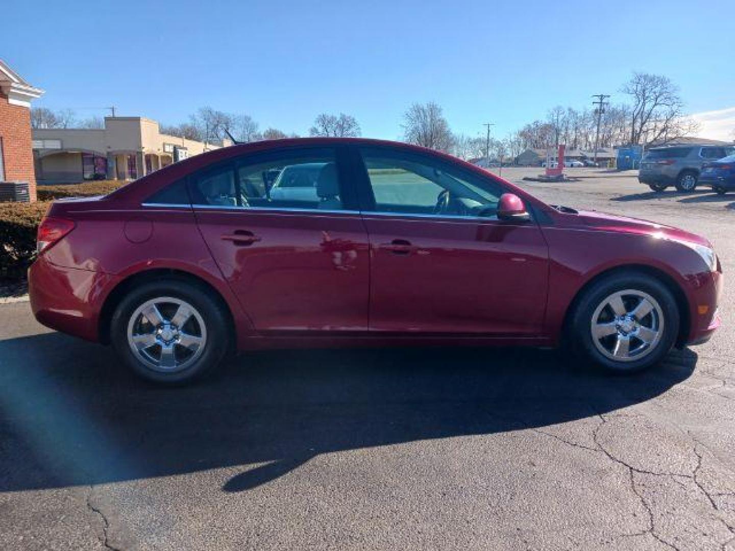 2014 Red Hot Chevrolet Cruze 1LT Auto (1G1PC5SB2E7) with an 1.4L L4 DOHC 16V TURBO engine, 6-Speed Automatic transmission, located at 4508 South Dixie Dr, Moraine, OH, 45439, (937) 908-9800, 39.689976, -84.218452 - Photo#5