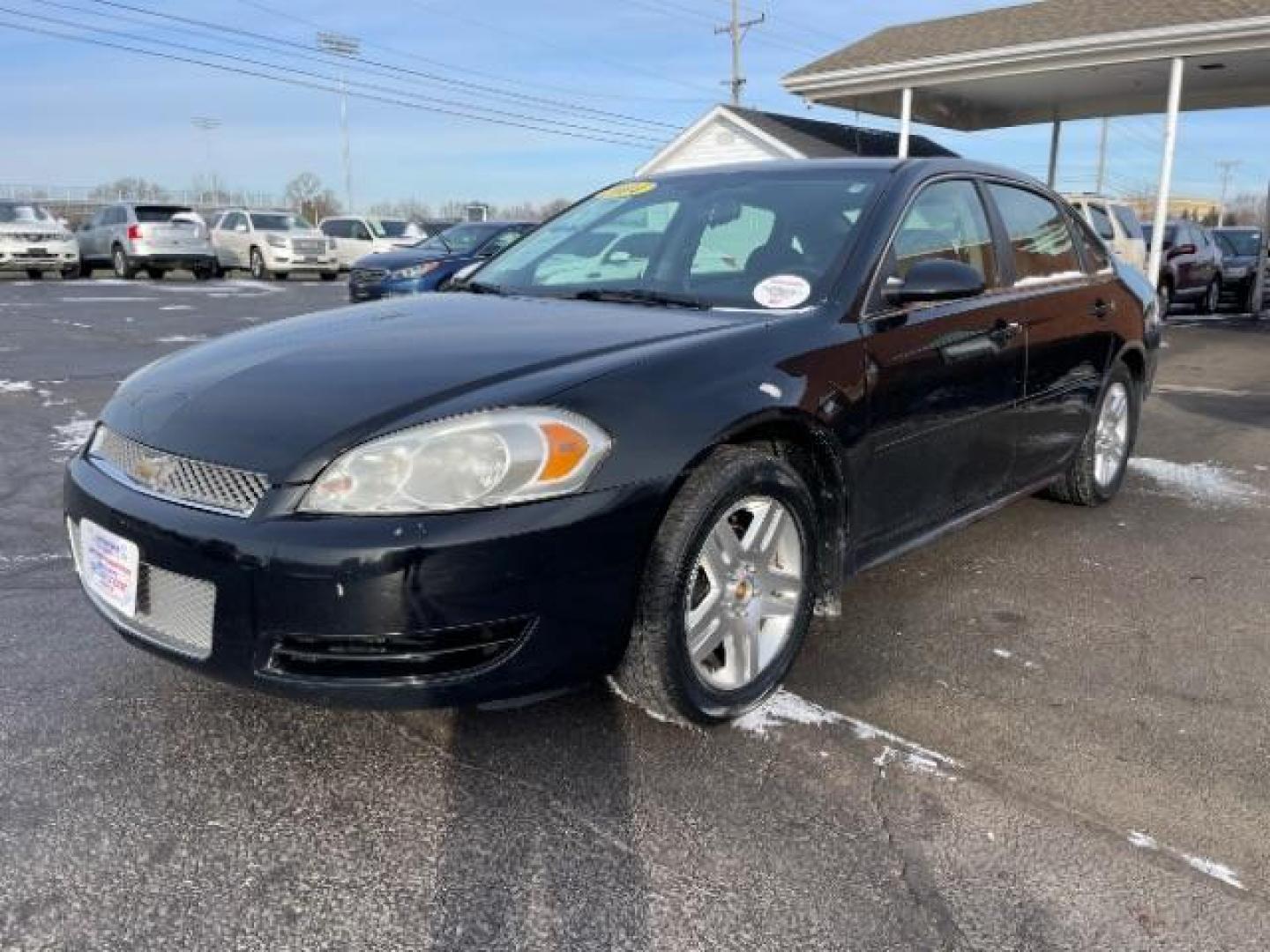 2014 Black Chevrolet Impala Limited LT (2G1WB5E37E1) with an 3.6L V6 DOHC 16V FFV engine, 6-Speed Automatic transmission, located at 1099 N County Rd 25A, Troy, OH, 45373, (937) 908-9800, 40.057079, -84.212883 - Photo#1