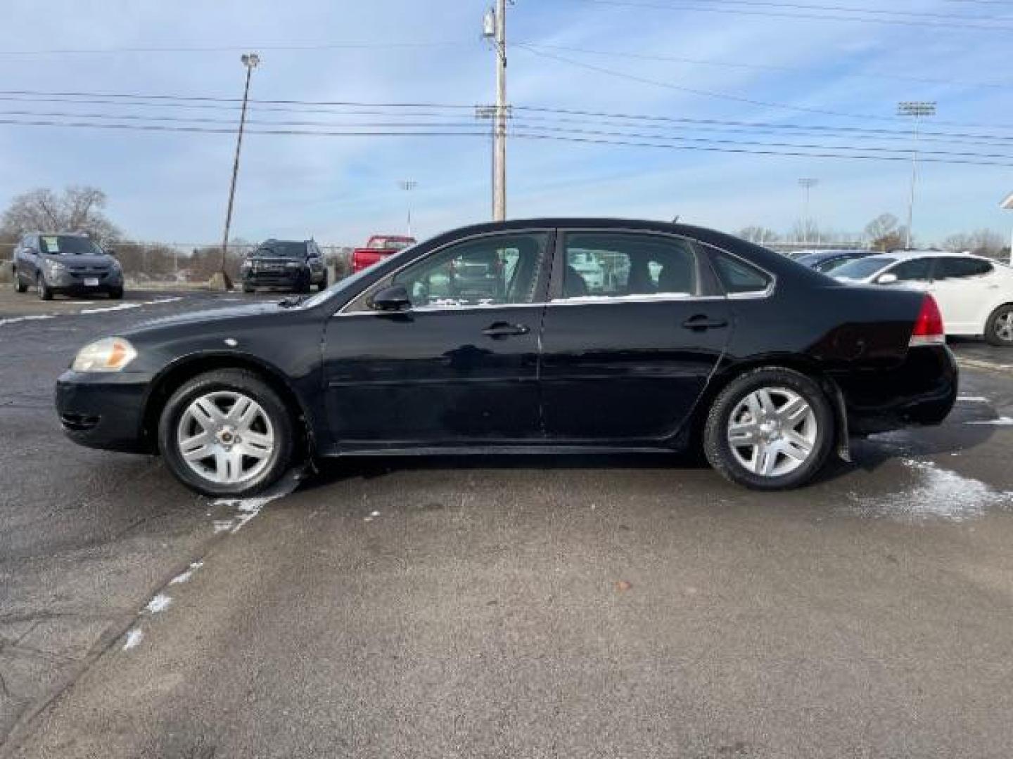 2014 Black Chevrolet Impala Limited LT (2G1WB5E37E1) with an 3.6L V6 DOHC 16V FFV engine, 6-Speed Automatic transmission, located at 1099 N County Rd 25A, Troy, OH, 45373, (937) 908-9800, 40.057079, -84.212883 - Photo#2