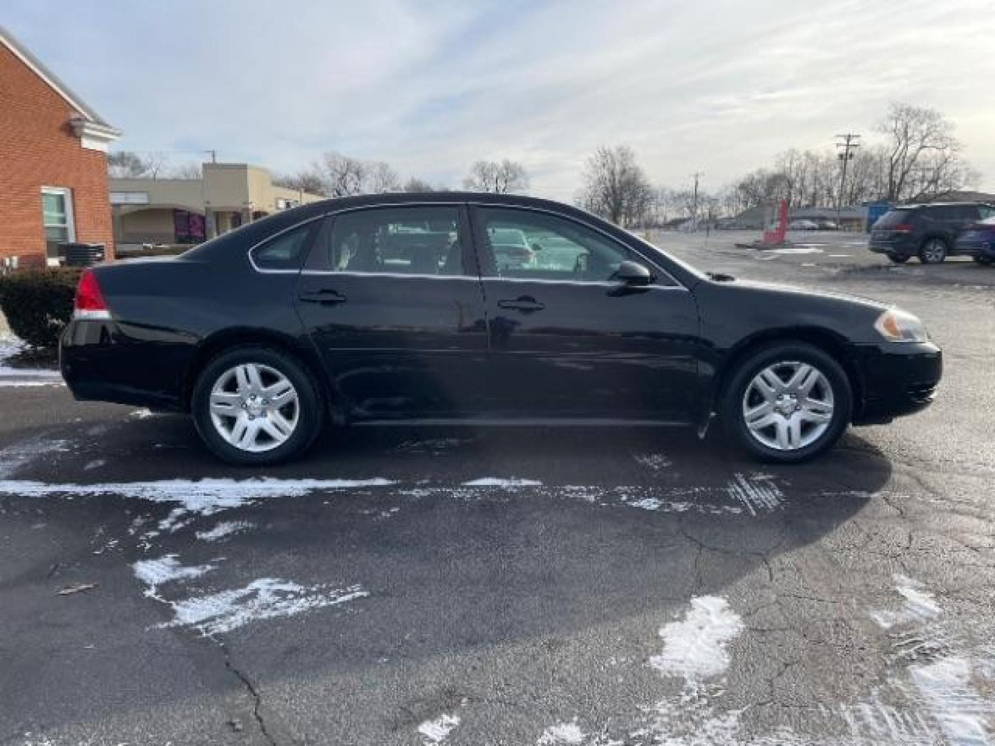 2014 Black Chevrolet Impala Limited LT (2G1WB5E37E1) with an 3.6L V6 DOHC 16V FFV engine, 6-Speed Automatic transmission, located at 1099 N County Rd 25A, Troy, OH, 45373, (937) 908-9800, 40.057079, -84.212883 - Photo#3