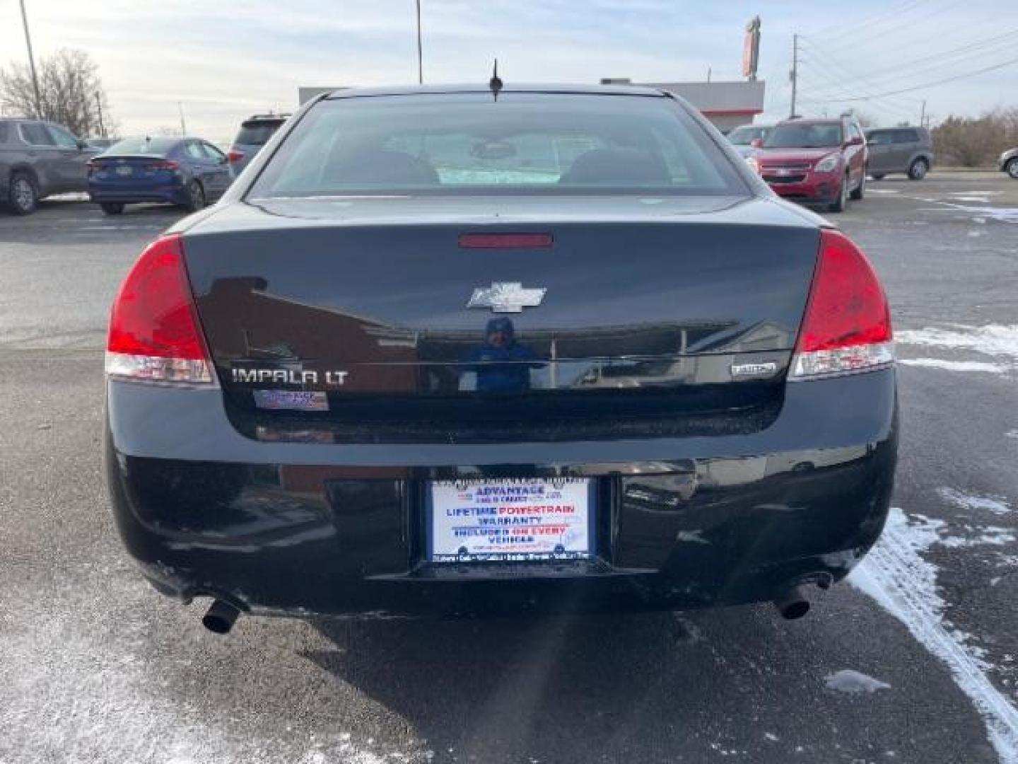 2014 Black Chevrolet Impala Limited LT (2G1WB5E37E1) with an 3.6L V6 DOHC 16V FFV engine, 6-Speed Automatic transmission, located at 1099 N County Rd 25A, Troy, OH, 45373, (937) 908-9800, 40.057079, -84.212883 - Photo#4