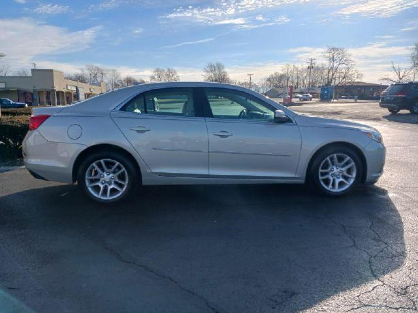 2014 Champagne Silver Metallic Chevrolet Malibu 1LT (1G11C5SL6EF) with an 2.5L L4 DOHC 16V engine, 6-Speed Automatic transmission, located at 4508 South Dixie Dr, Moraine, OH, 45439, (937) 908-9800, 39.689976, -84.218452 - Photo#4