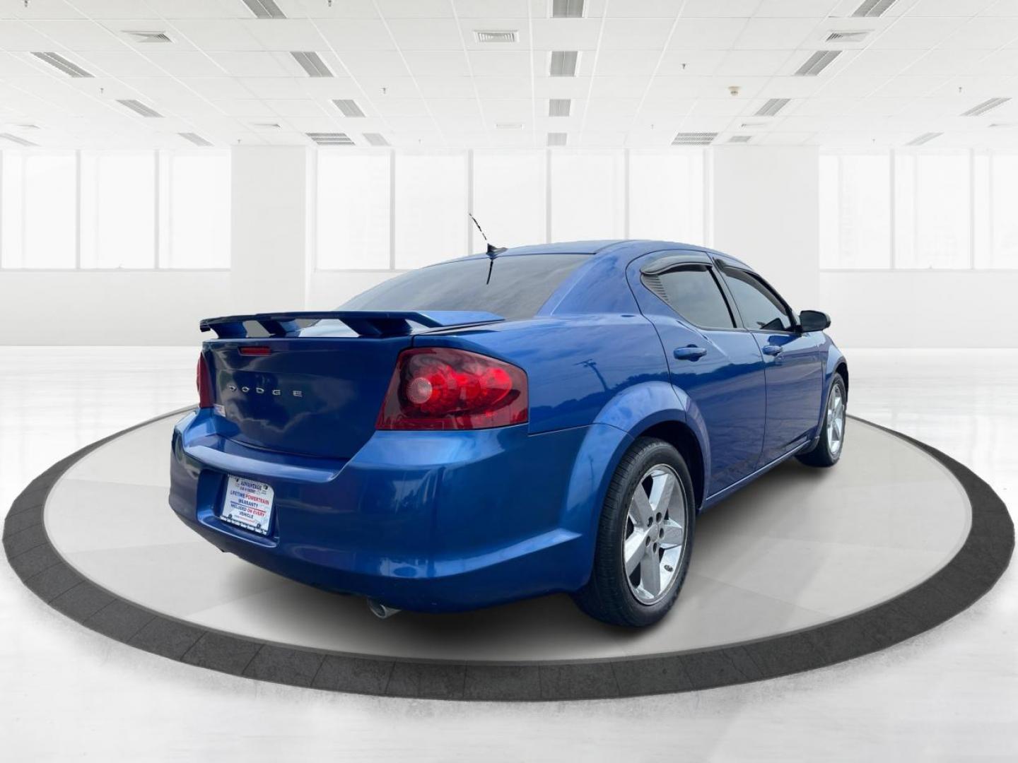 2014 Blue Streak Pearlcoat Dodge Avenger SE (1C3CDZAG1EN) with an 3.6L V6 DOHC 24V FFV engine, 6-Speed Automatic transmission, located at 1099 N County Rd 25A, Troy, OH, 45373, (937) 908-9800, 40.057079, -84.212883 - Photo#2