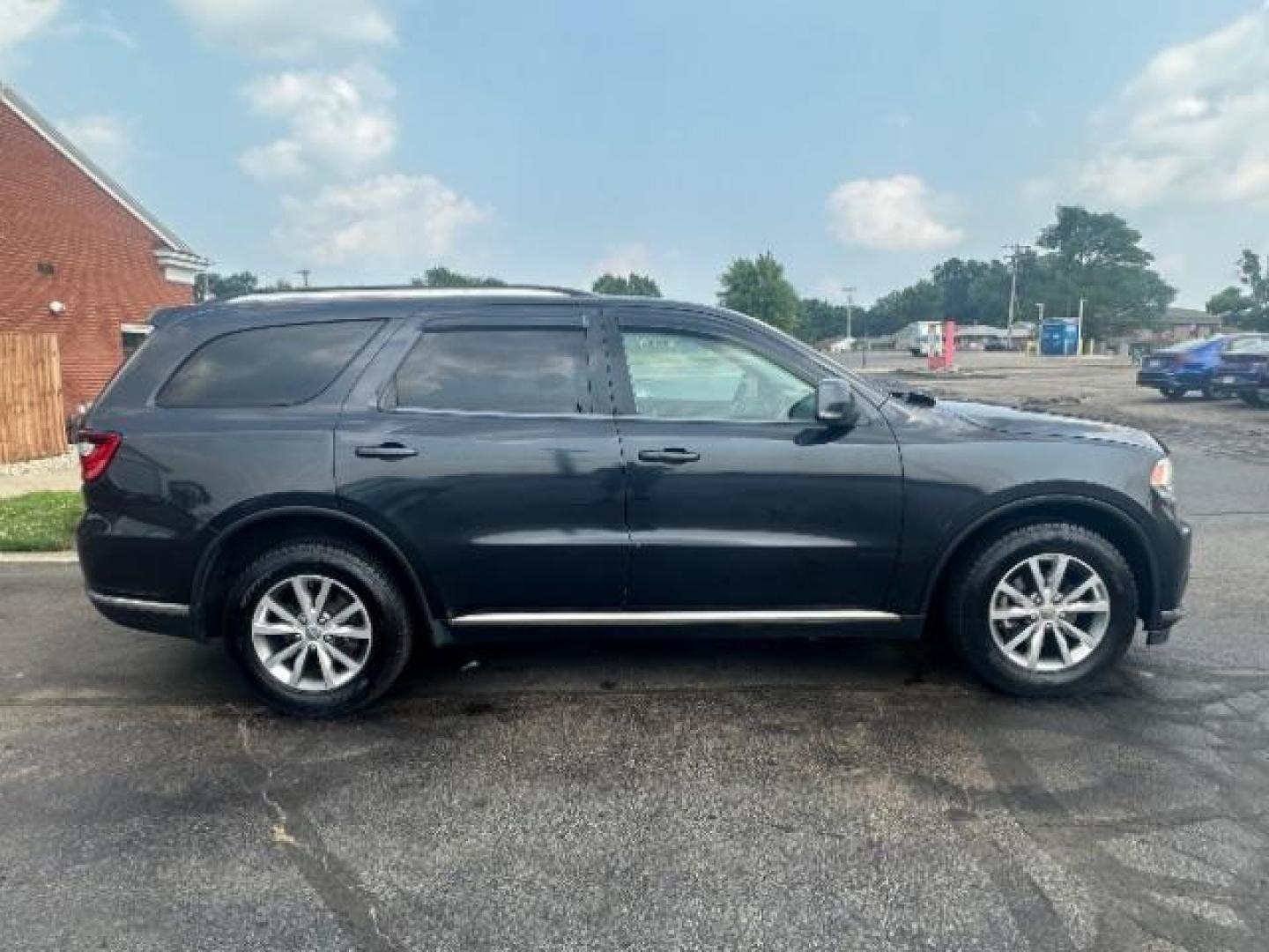 2014 Granite Crystal Met CC Dodge Durango Limited AWD (1C4RDJDG3EC) with an 3.6L V6 DOHC 24V engine, 8-Speed Automatic transmission, located at 1099 N County Rd 25A, Troy, OH, 45373, (937) 908-9800, 40.057079, -84.212883 - Third Row - Photo#5