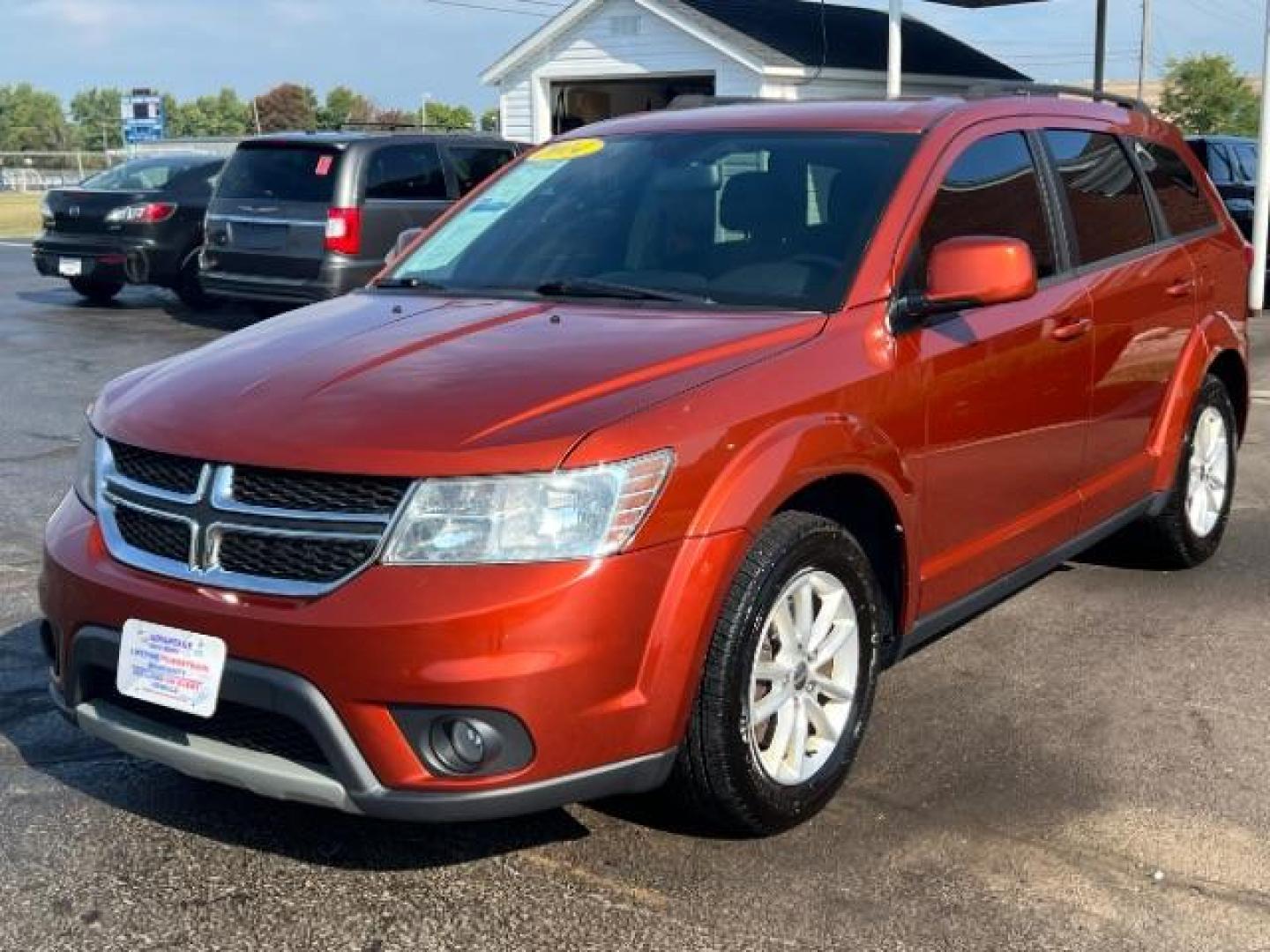 2014 Copperhead Pearlcoat Dodge Journey SXT (3C4PDCBB5ET) with an 2.4L L6 DOHC 16V engine, 4-Speed Automatic transmission, located at 1099 N County Rd 25A, Troy, OH, 45373, (937) 908-9800, 40.057079, -84.212883 - Photo#2