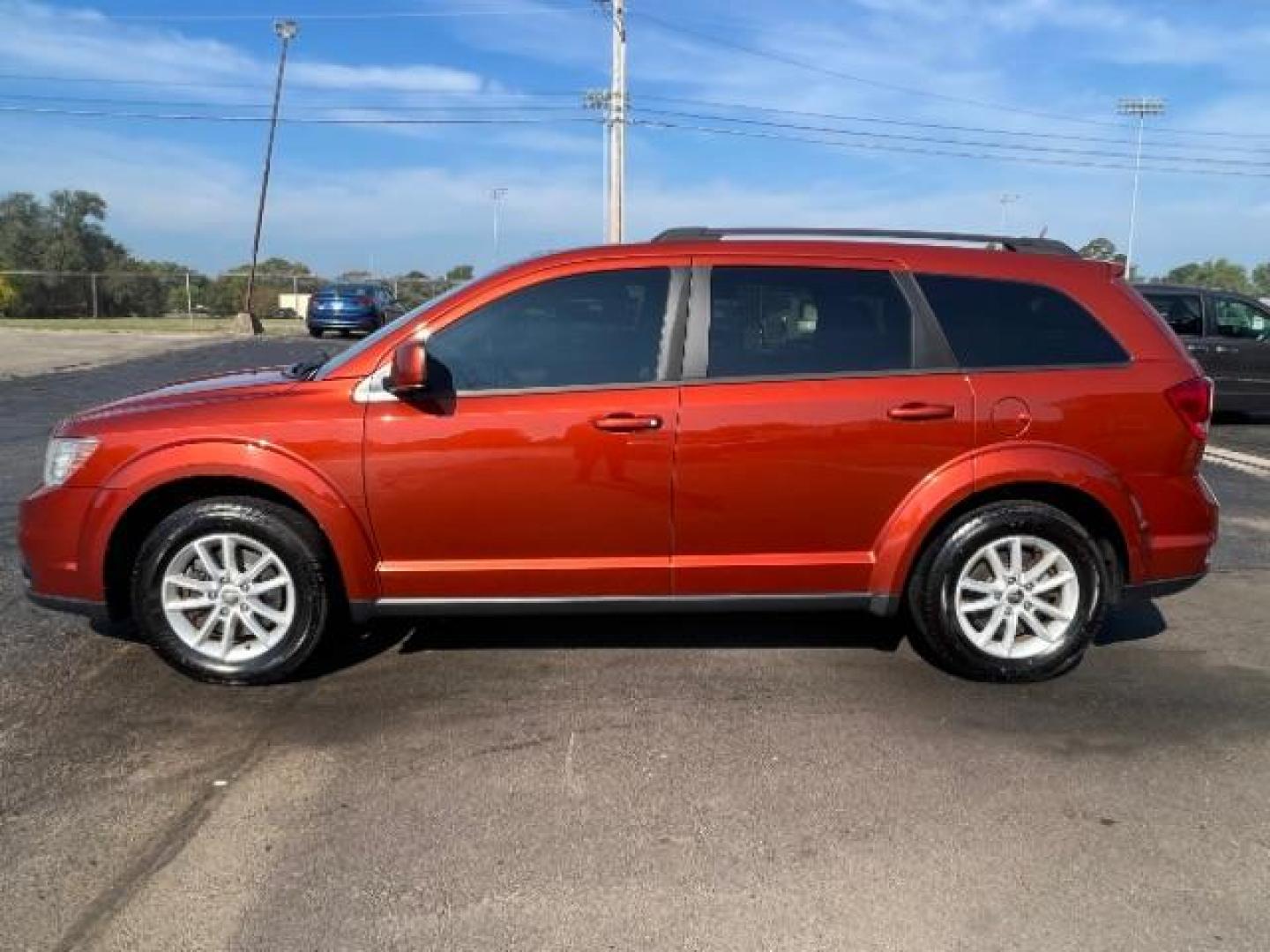 2014 Copperhead Pearlcoat Dodge Journey SXT (3C4PDCBB5ET) with an 2.4L L6 DOHC 16V engine, 4-Speed Automatic transmission, located at 1099 N County Rd 25A, Troy, OH, 45373, (937) 908-9800, 40.057079, -84.212883 - Photo#3