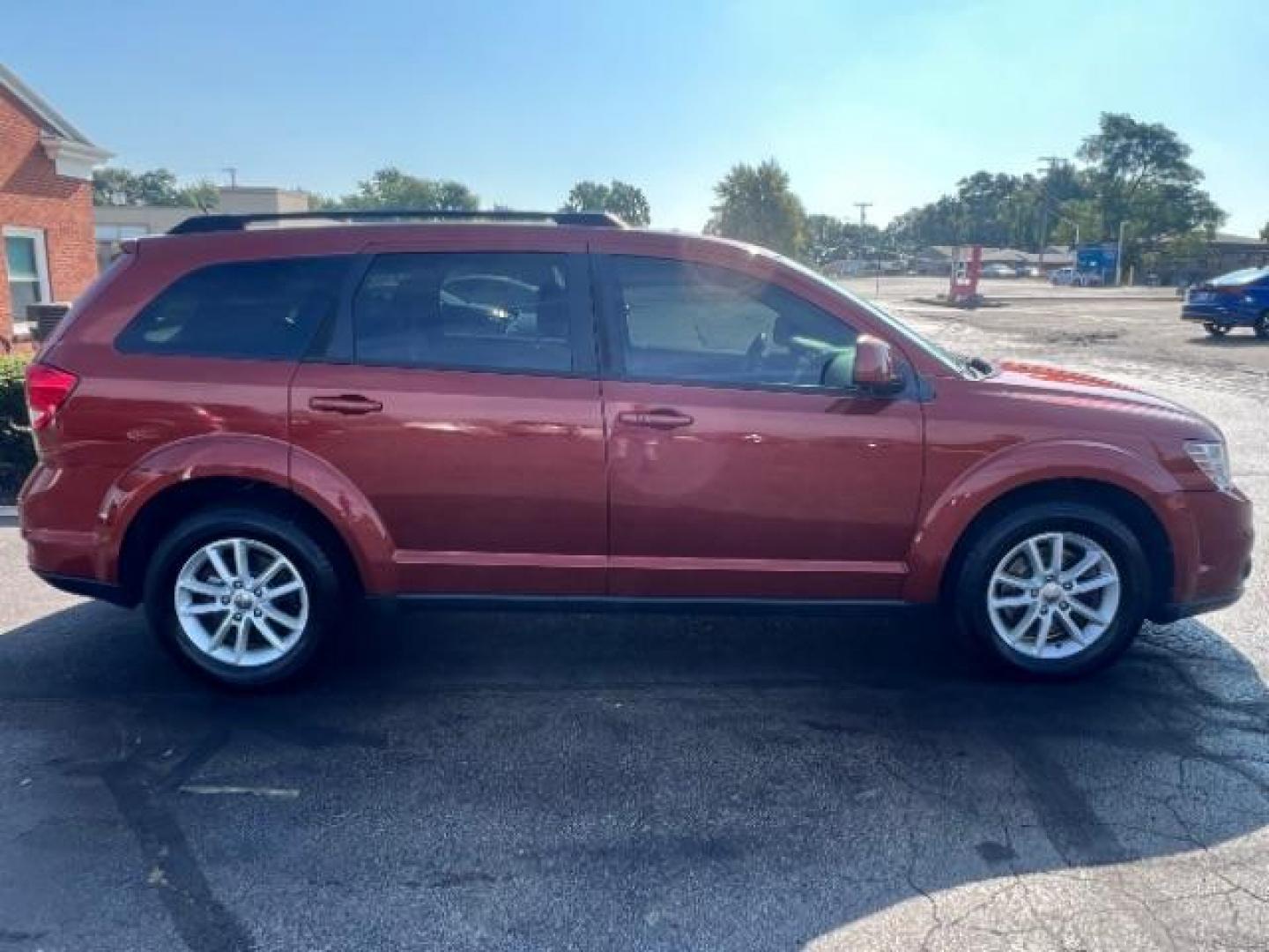 2014 Copperhead Pearlcoat Dodge Journey SXT (3C4PDCBB5ET) with an 2.4L L6 DOHC 16V engine, 4-Speed Automatic transmission, located at 1099 N County Rd 25A, Troy, OH, 45373, (937) 908-9800, 40.057079, -84.212883 - Photo#5