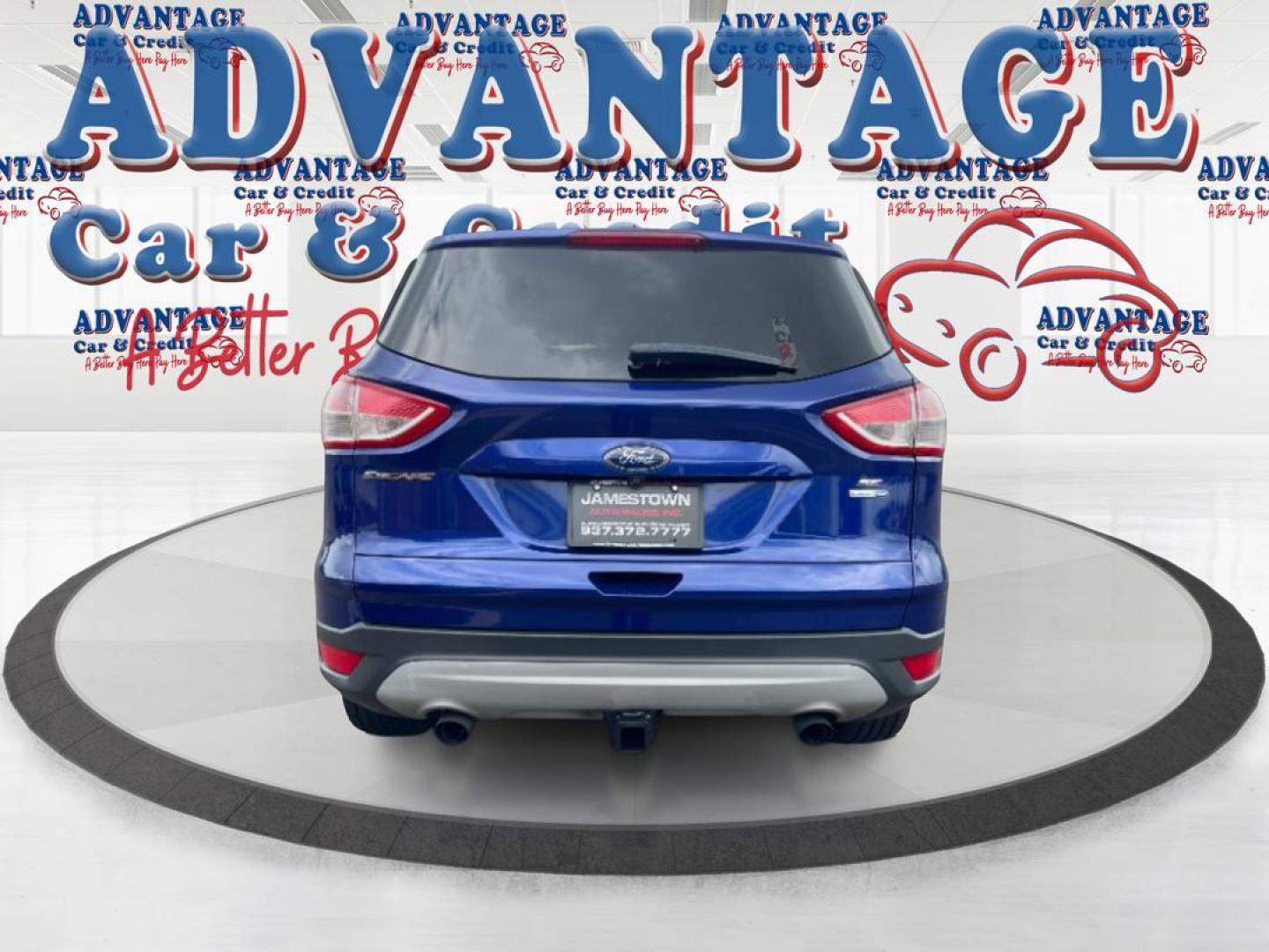 2014 Deep Impact Blue Ford Escape SE 4WD (1FMCU9G96EU) with an 2.0L L4 DOHC 16V engine, 6-Speed Automatic transmission, located at 4508 South Dixie Dr, Moraine, OH, 45439, (937) 908-9800, 39.689976, -84.218452 - Photo#2