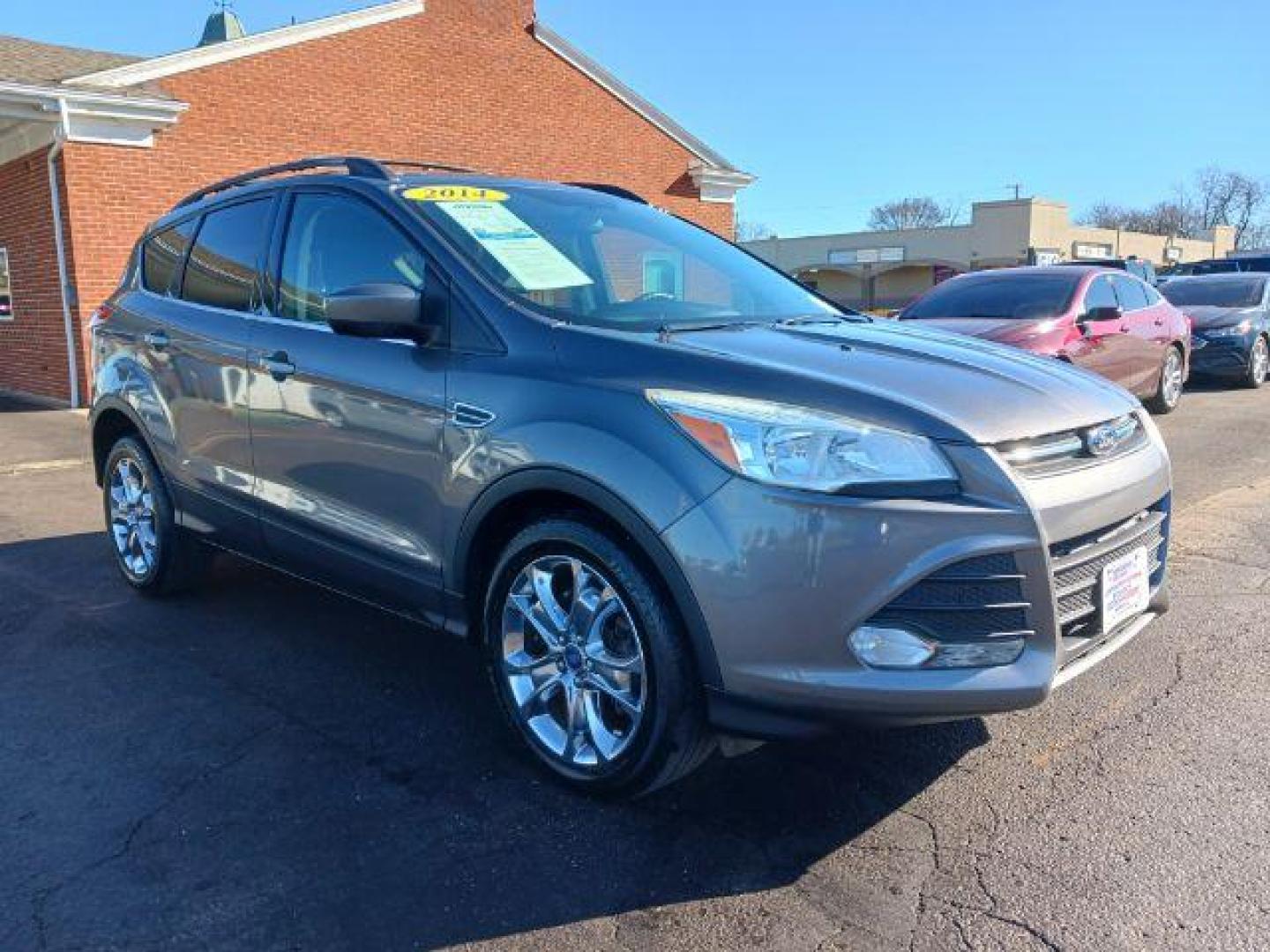 2014 Sterling Gray Metallic Ford Escape SE 4WD (1FMCU9G98EU) with an 2.0L L4 DOHC 16V engine, 6-Speed Automatic transmission, located at 401 Woodman Dr, Riverside, OH, 45431, (937) 908-9800, 39.760899, -84.123421 - Photo#0