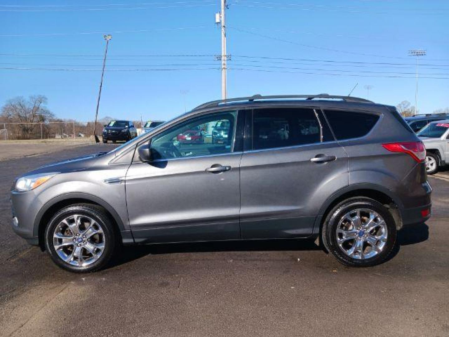 2014 Sterling Gray Metallic Ford Escape SE 4WD (1FMCU9G98EU) with an 2.0L L4 DOHC 16V engine, 6-Speed Automatic transmission, located at 401 Woodman Dr, Riverside, OH, 45431, (937) 908-9800, 39.760899, -84.123421 - Photo#3