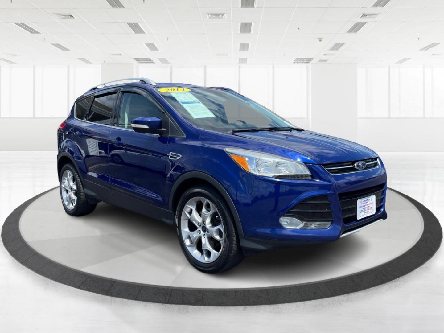 2014 Deep Impact Blue Ford Escape Titanium 4WD (1FMCU9J91EU) with an 2.0L L4 DOHC 16V engine, 6-Speed Automatic transmission, located at 401 Woodman Dr, Riverside, OH, 45431, (937) 908-9800, 39.760899, -84.123421 - Photo#0