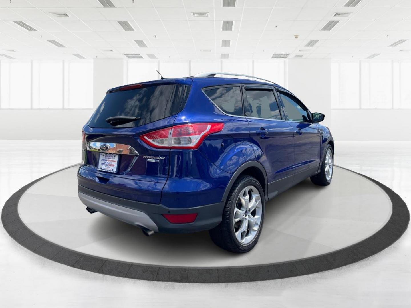 2014 Deep Impact Blue Ford Escape Titanium 4WD (1FMCU9J91EU) with an 2.0L L4 DOHC 16V engine, 6-Speed Automatic transmission, located at 401 Woodman Dr, Riverside, OH, 45431, (937) 908-9800, 39.760899, -84.123421 - Photo#2