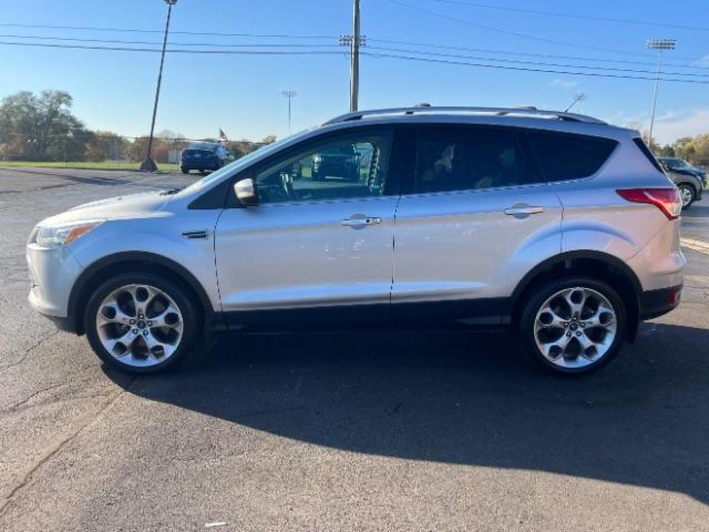 2014 Sterling Gray Metallic Ford Escape Titanium 4WD (1FMCU9J96EU) with an 2.0L L4 DOHC 16V engine, 6-Speed Automatic transmission, located at 1184 Kauffman Ave, Fairborn, OH, 45324, (937) 908-9800, 39.807072, -84.030914 - Photo#3