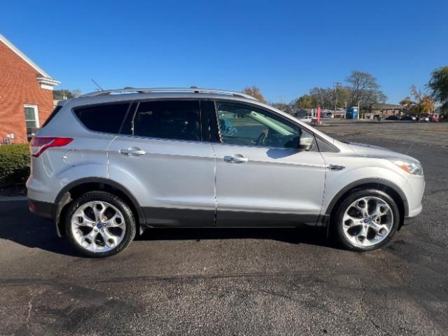 2014 Sterling Gray Metallic Ford Escape Titanium 4WD (1FMCU9J96EU) with an 2.0L L4 DOHC 16V engine, 6-Speed Automatic transmission, located at 1184 Kauffman Ave, Fairborn, OH, 45324, (937) 908-9800, 39.807072, -84.030914 - Photo#5