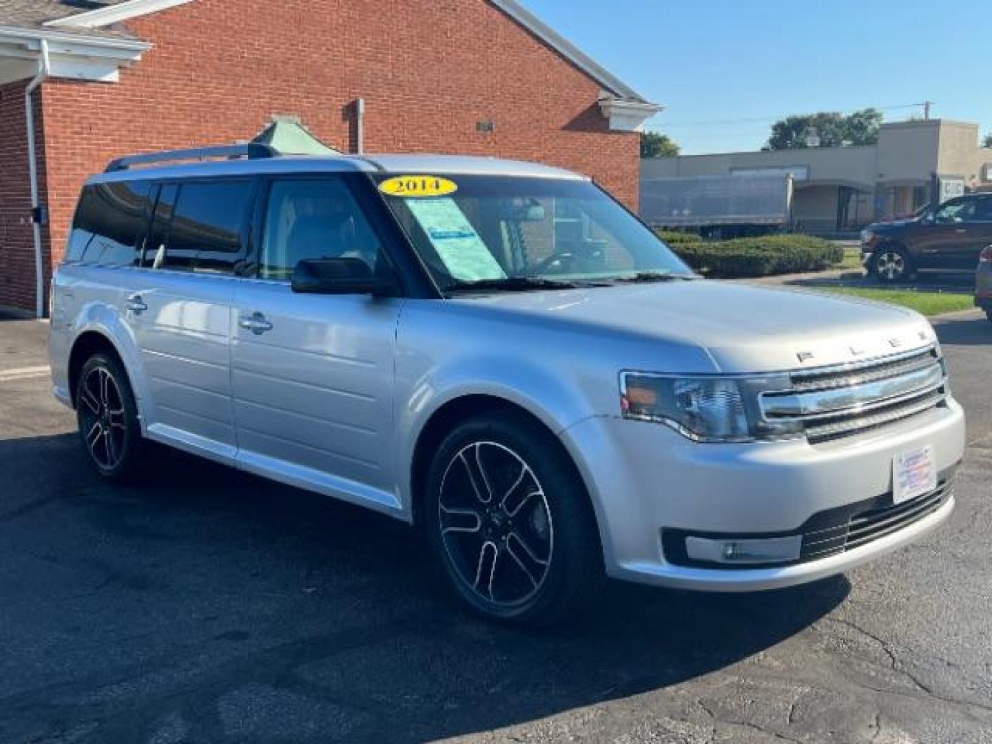 2014 Ingot Silver Metallic Ford Flex SEL FWD (2FMGK5C88EB) with an 3.5L V6 DOHC 24V engine, 6-Speed Automatic Overdrive transmission, located at 880 E. National Road, Vandalia, OH, 45377, (937) 908-9800, 39.891918, -84.183594 - Photo#0