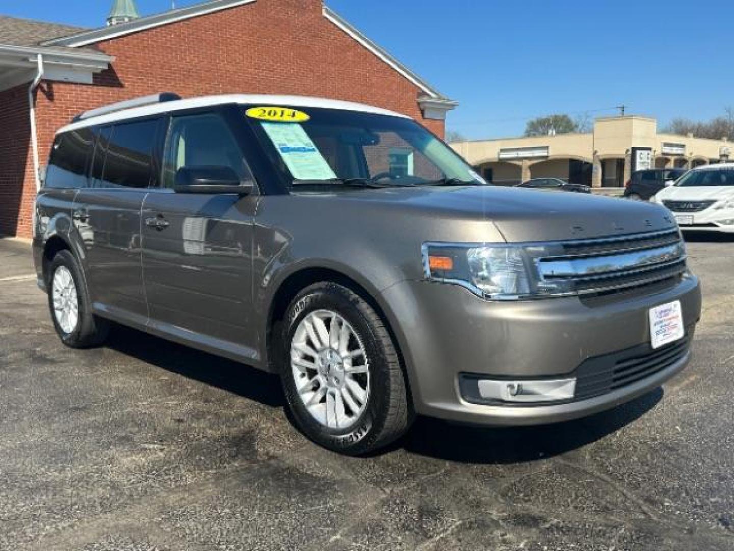 2014 Mineral Gray Metallic Ford Flex SEL FWD (2FMGK5C84EB) with an 3.5L V6 DOHC 24V engine, 6-Speed Automatic Overdrive transmission, located at 1951 S Dayton Lakeview Rd., New Carlisle, OH, 45344, (937) 908-9800, 39.890999, -84.050255 - Photo#0