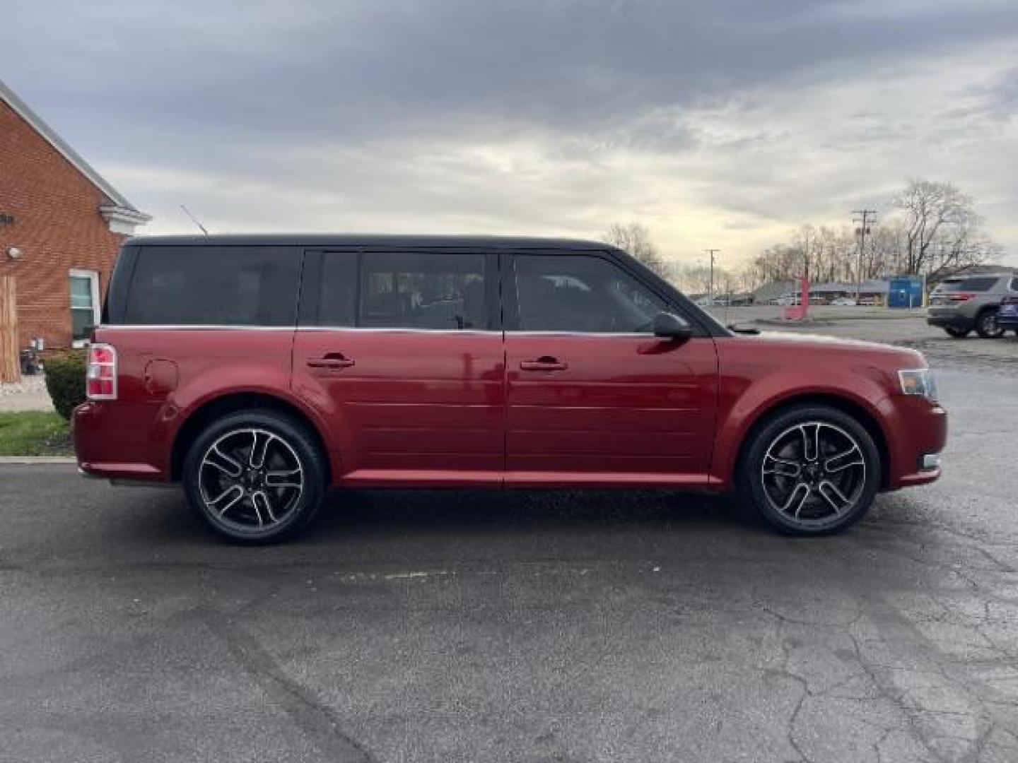 2014 Orange Ford Flex SEL FWD (2FMGK5C89EB) with an 3.5L V6 DOHC 24V engine, 6-Speed Automatic Overdrive transmission, located at 401 Woodman Dr, Riverside, OH, 45431, (937) 908-9800, 39.760899, -84.123421 - Photo#2