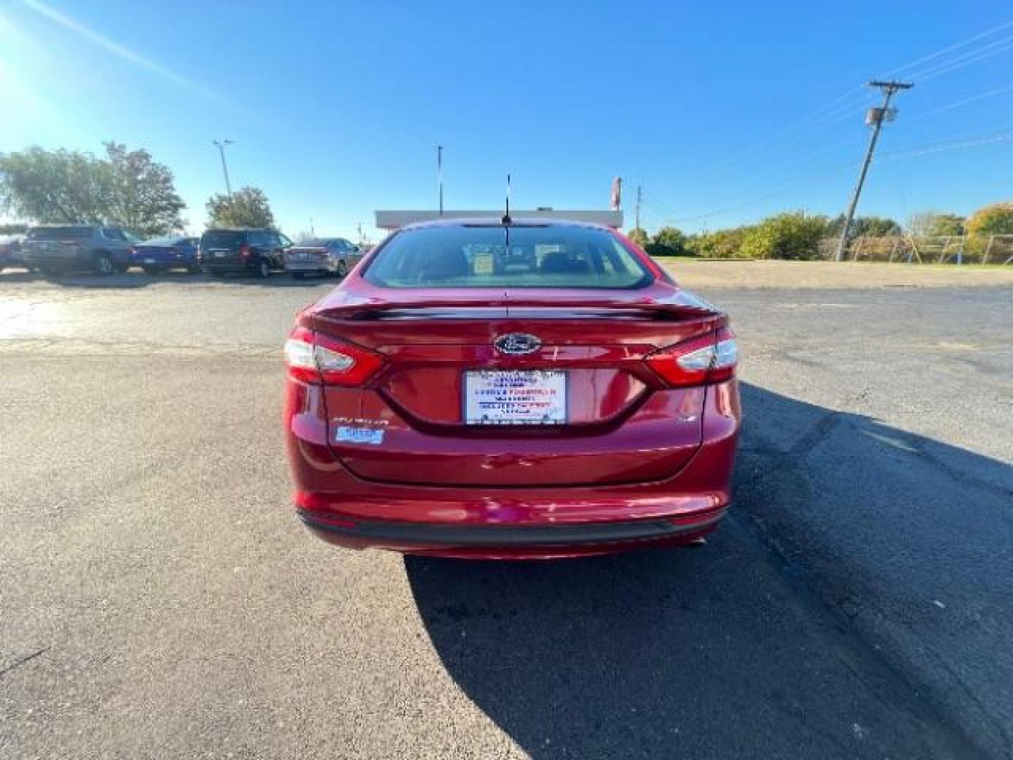 2014 Ruby Red Met Tinted CC Ford Fusion SE (3FA6P0H77ER) with an 2.5L L4 DOHC 16V engine, located at 1184 Kauffman Ave, Fairborn, OH, 45324, (937) 908-9800, 39.807072, -84.030914 - Photo#4