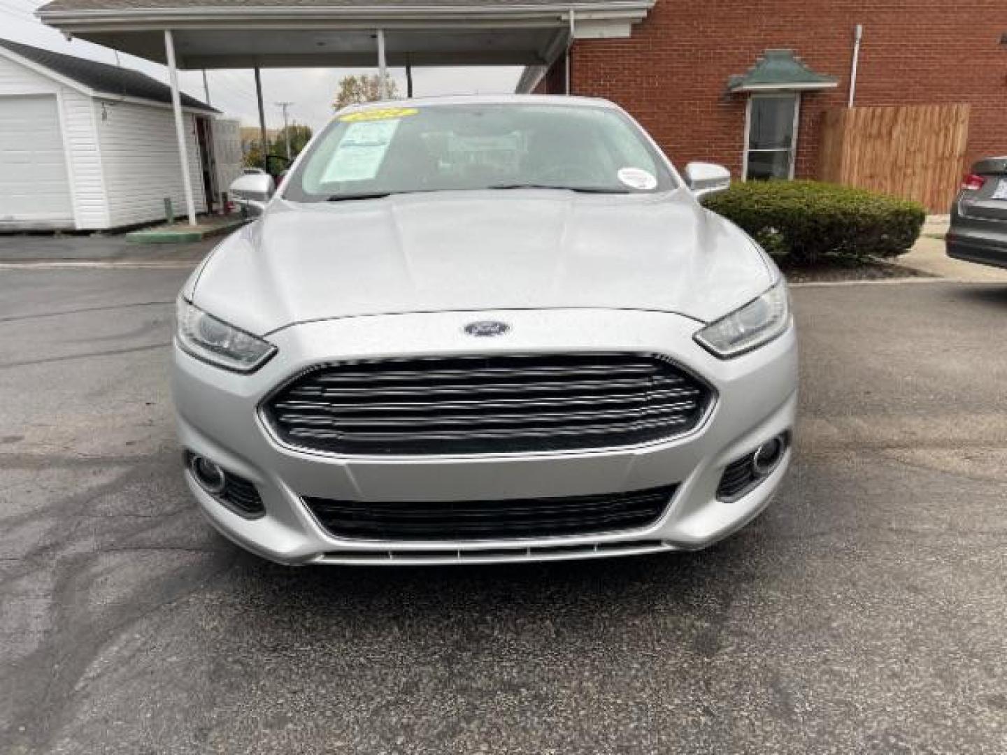 2014 Sterling Gray Ford Fusion Titanium (3FA6P0K90ER) with an 2.0L L4 DOHC 16V engine, located at 1230 East Main St, Xenia, OH, 45385, (937) 908-9800, 39.688026, -83.910172 - Photo#1