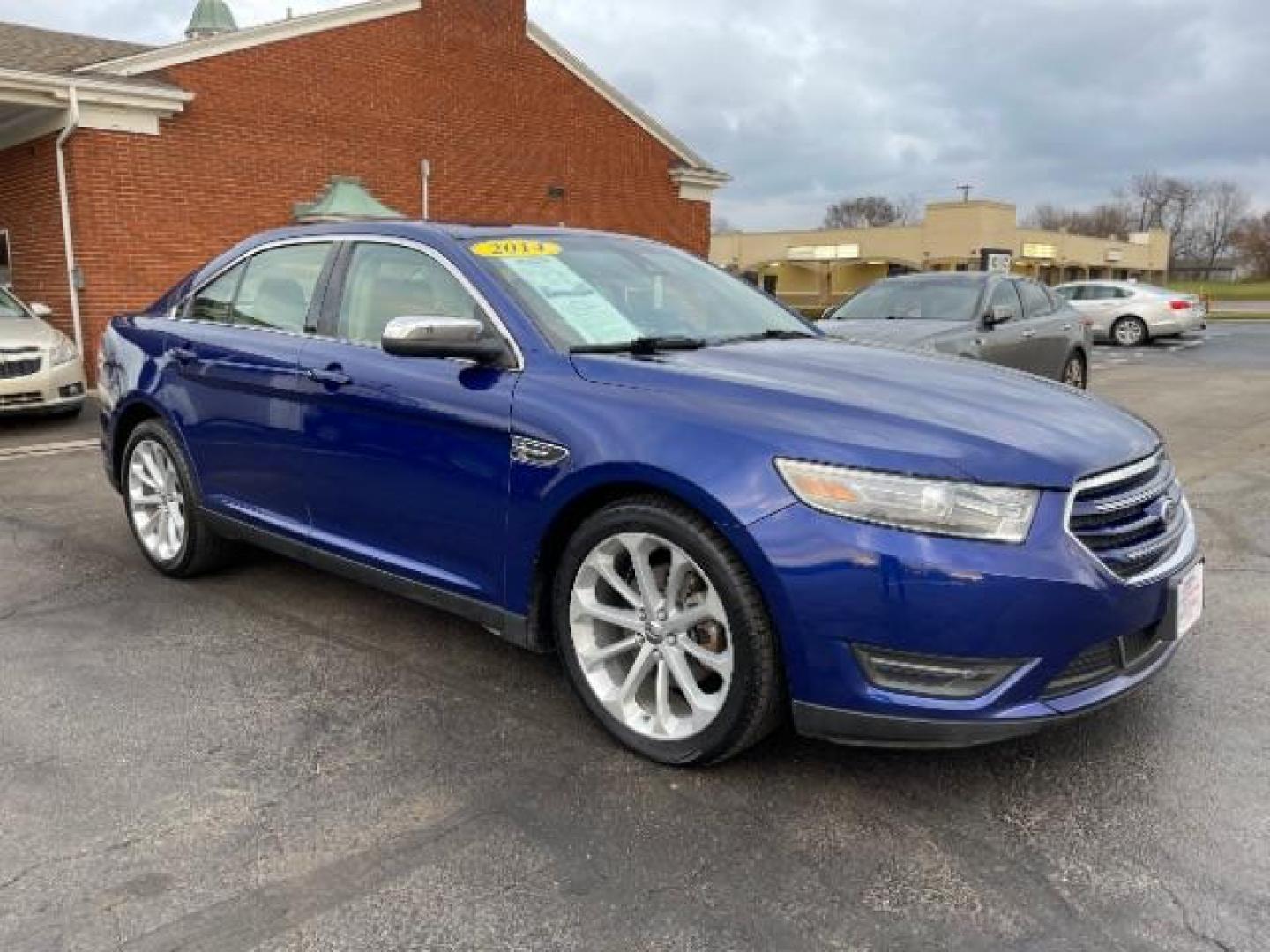 2014 Deep Impact Blue Metallic Ford Taurus Limited AWD (1FAHP2J86EG) with an 3.5L V6 DOHC 24V engine, 6-Speed Automatic transmission, located at 1230 East Main St, Xenia, OH, 45385, (937) 908-9800, 39.688026, -83.910172 - Photo#0