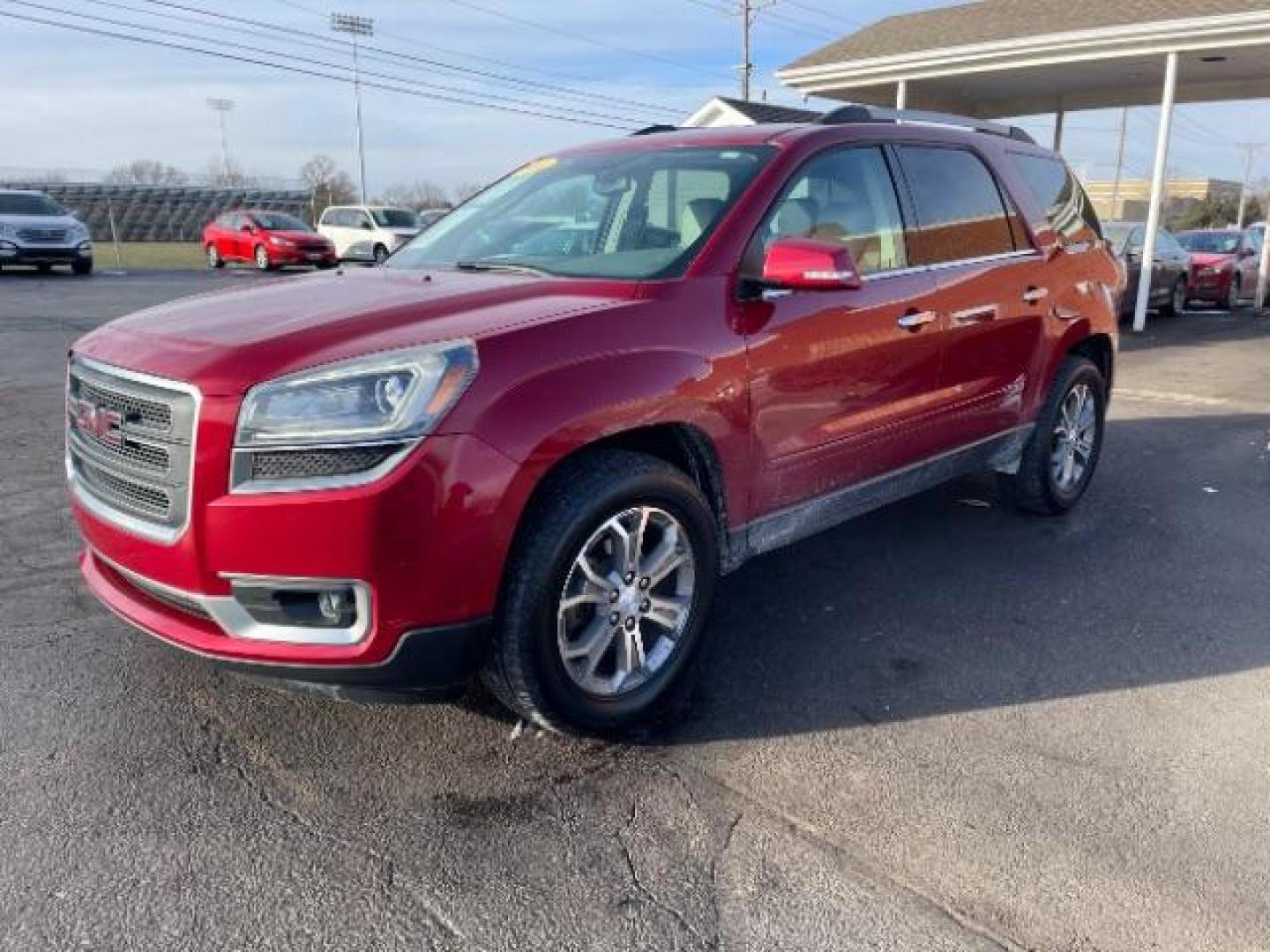 2014 Crystal Red Tintcoat GMC Acadia SLT-1 FWD (1GKKRRKDXEJ) with an 3.6L V6 DOHC 24V engine, 6-Speed Automatic transmission, located at 1951 S Dayton Lakeview Rd., New Carlisle, OH, 45344, (937) 908-9800, 39.890999, -84.050255 - Photo#1