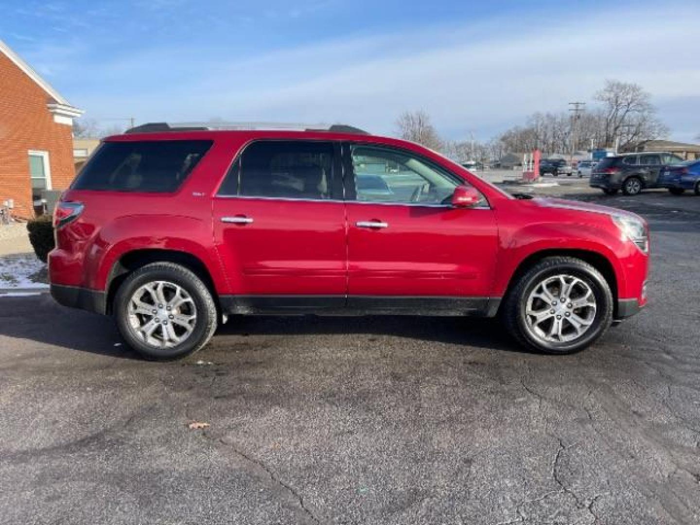 2014 Crystal Red Tintcoat GMC Acadia SLT-1 FWD (1GKKRRKDXEJ) with an 3.6L V6 DOHC 24V engine, 6-Speed Automatic transmission, located at 1951 S Dayton Lakeview Rd., New Carlisle, OH, 45344, (937) 908-9800, 39.890999, -84.050255 - Photo#2