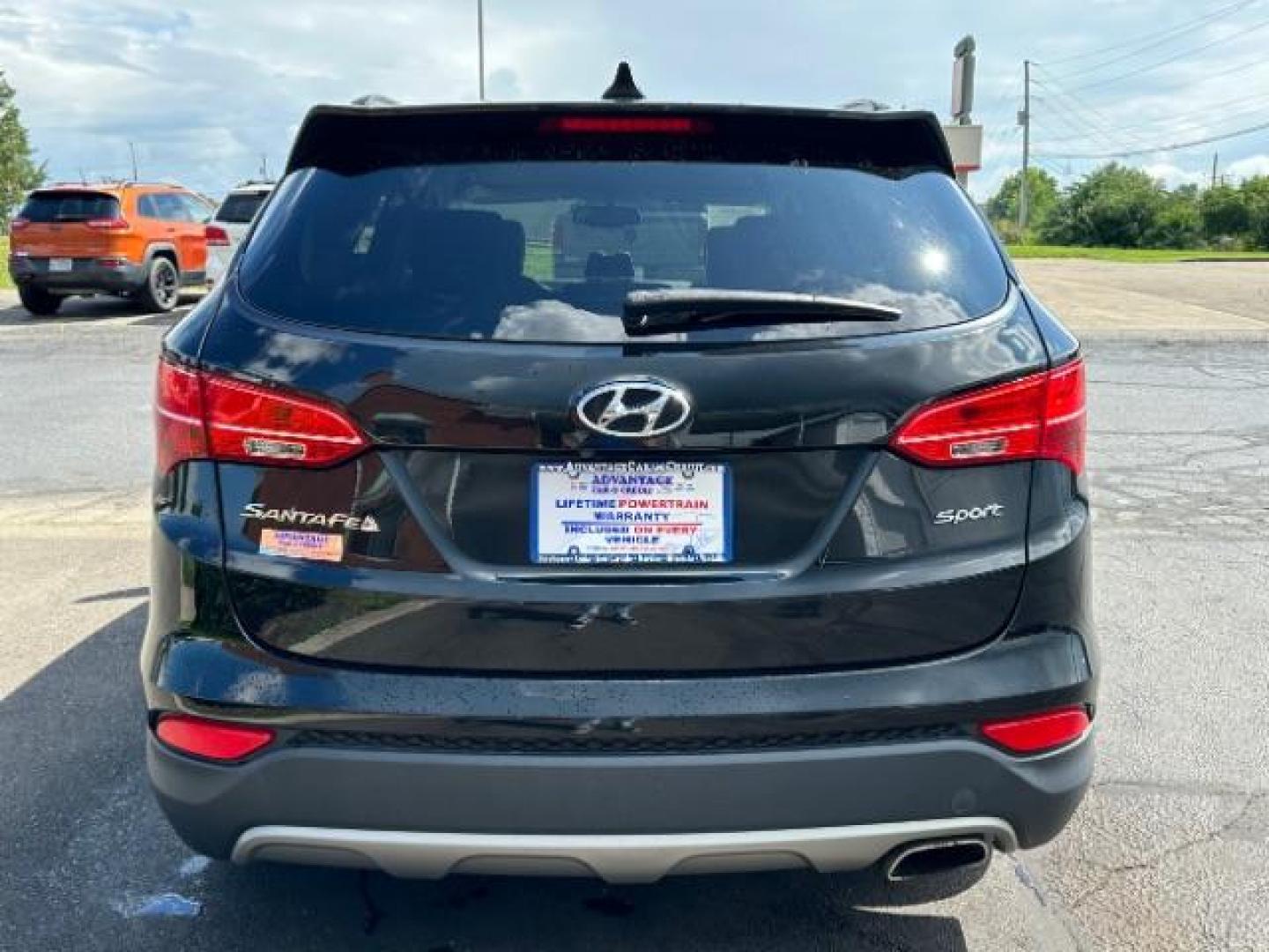 2014 Twilight Black Hyundai Santa Fe Sport 2.4 FWD (5XYZU3LB4EG) with an 2.4L L4 DOHC 16V engine, 6-Speed Automatic transmission, located at 401 Woodman Dr, Riverside, OH, 45431, (937) 908-9800, 39.760899, -84.123421 - Photo#4