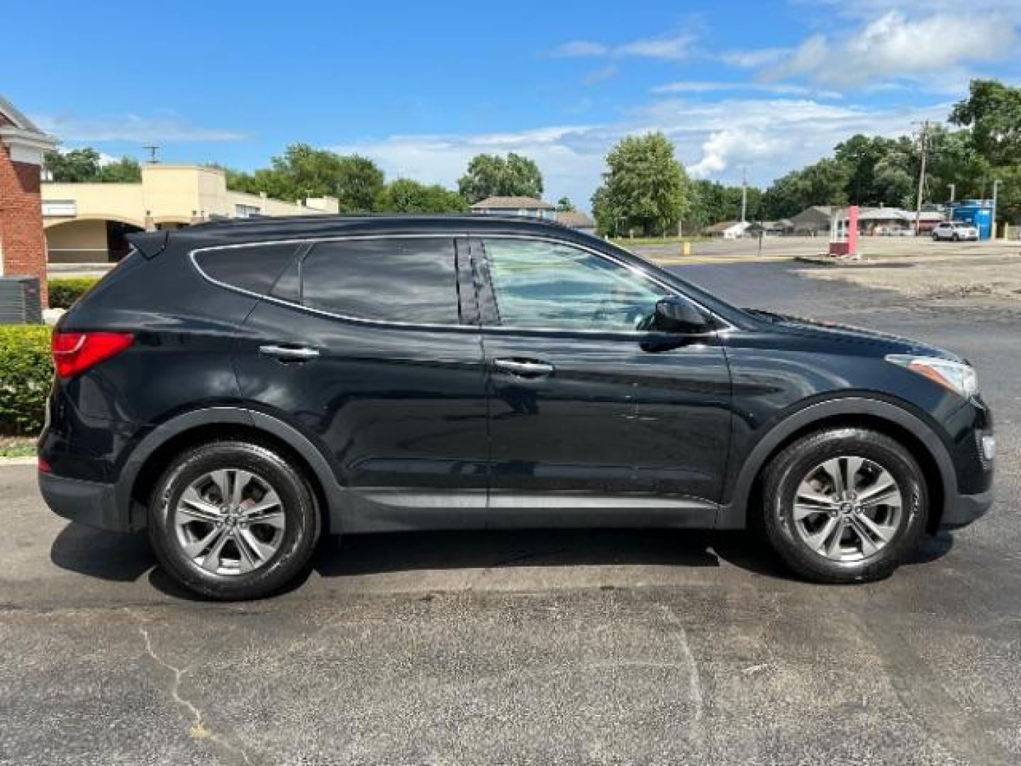 2014 Twilight Black Hyundai Santa Fe Sport 2.4 FWD (5XYZU3LB4EG) with an 2.4L L4 DOHC 16V engine, 6-Speed Automatic transmission, located at 401 Woodman Dr, Riverside, OH, 45431, (937) 908-9800, 39.760899, -84.123421 - Photo#5