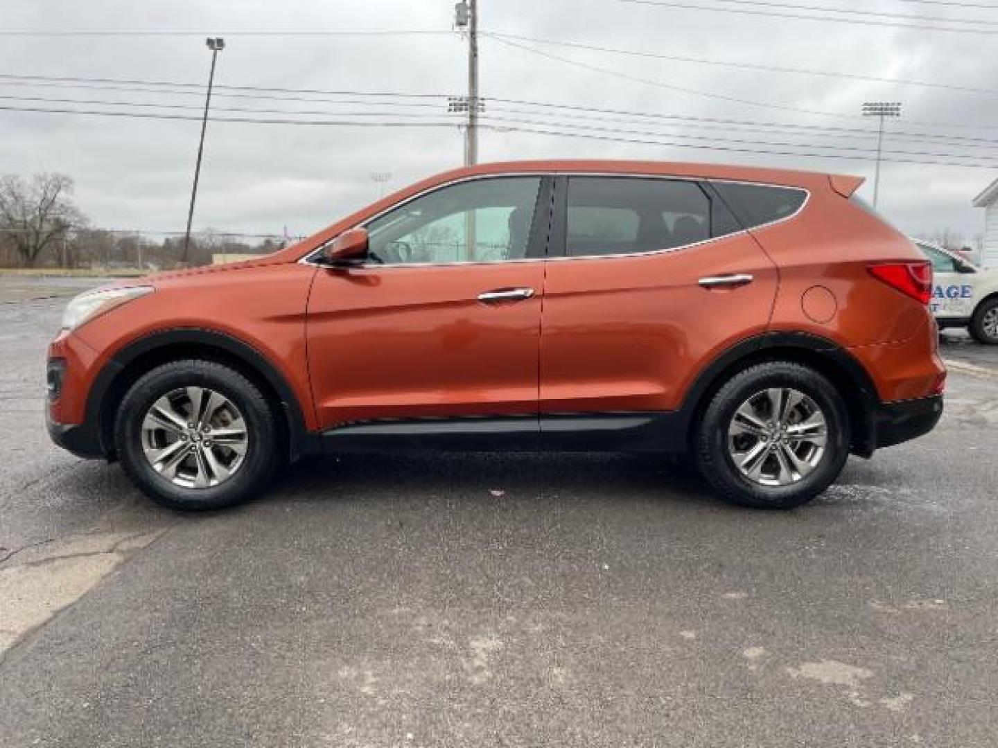 2014 Canyon Copper Hyundai Santa Fe Sport 2.4 FWD (5XYZT3LB1EG) with an 2.4L L4 DOHC 16V engine, 6-Speed Automatic transmission, located at 1184 Kauffman Ave, Fairborn, OH, 45324, (937) 908-9800, 39.807072, -84.030914 - Photo#2