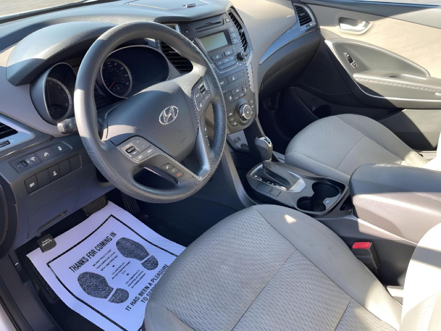 2014 Moonstone Silver Hyundai Santa Fe (5XYZTDLB2EG) with an 2.4L L4 DOHC 16V engine, 6-Speed Automatic transmission, located at 1099 N County Rd 25A, Troy, OH, 45373, (937) 908-9800, 40.057079, -84.212883 - Photo#5