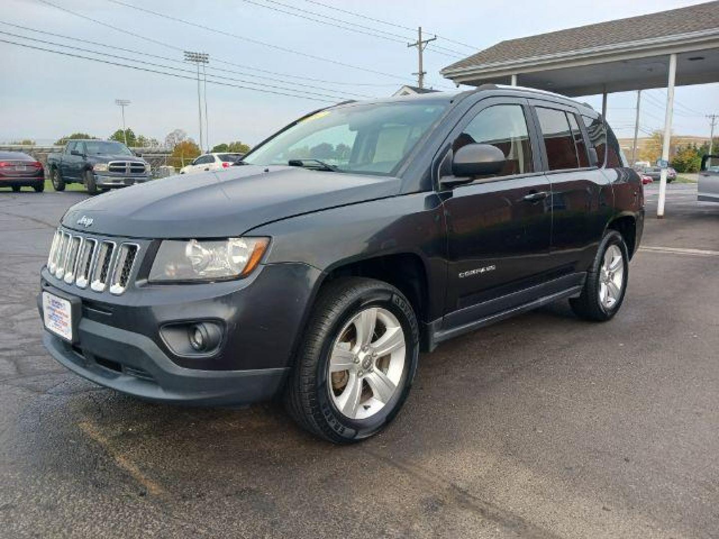 2014 Maximum Steel Metallic CC Jeep Compass Sport 4WD (1C4NJDBB5ED) with an 2.4L L4 DOHC 16V engine, located at 4508 South Dixie Dr, Moraine, OH, 45439, (937) 908-9800, 39.689976, -84.218452 - Photo#2