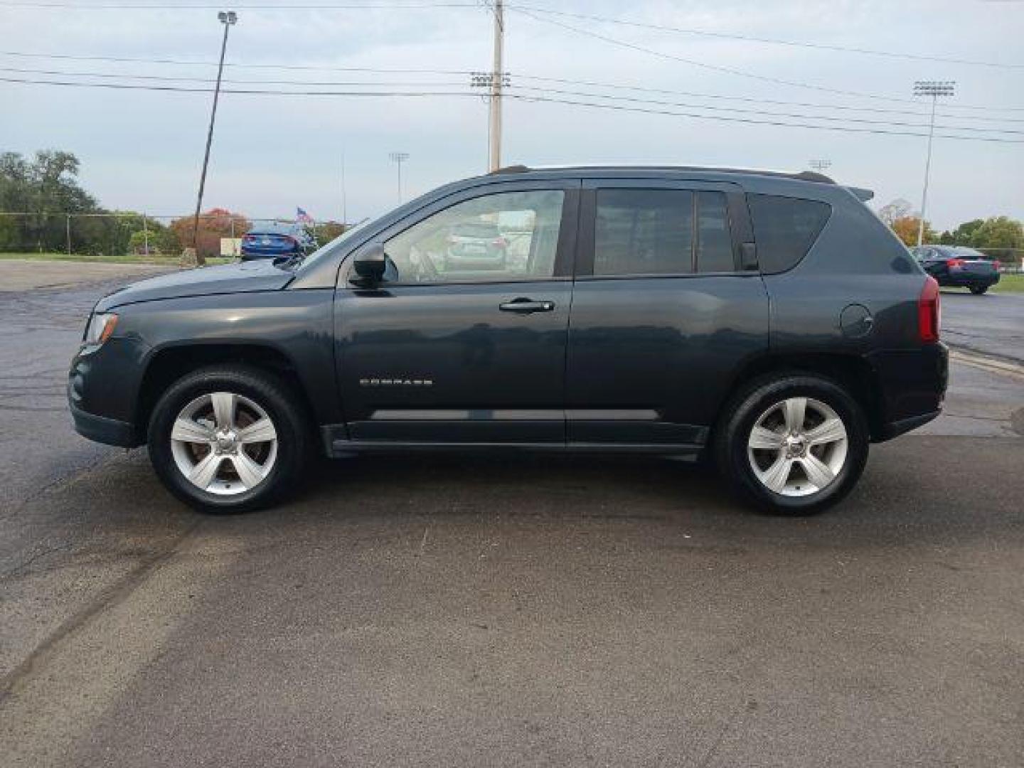 2014 Maximum Steel Metallic CC Jeep Compass Sport 4WD (1C4NJDBB5ED) with an 2.4L L4 DOHC 16V engine, located at 4508 South Dixie Dr, Moraine, OH, 45439, (937) 908-9800, 39.689976, -84.218452 - Photo#3