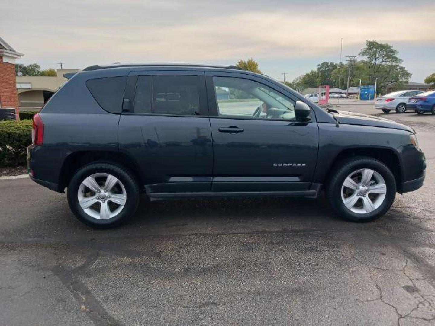 2014 Maximum Steel Metallic CC Jeep Compass Sport 4WD (1C4NJDBB5ED) with an 2.4L L4 DOHC 16V engine, located at 4508 South Dixie Dr, Moraine, OH, 45439, (937) 908-9800, 39.689976, -84.218452 - Photo#4