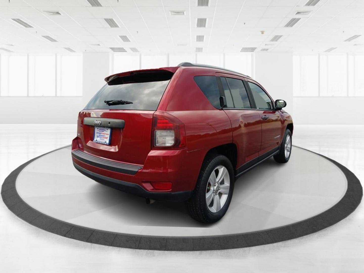 2014 Dp Cherry Red Crystal PC Jeep Compass Sport 4WD (1C4NJDBBXED) with an 2.4L L4 DOHC 16V engine, located at 1951 S Dayton Lakeview Rd., New Carlisle, OH, 45344, (937) 908-9800, 39.890999, -84.050255 - Photo#2