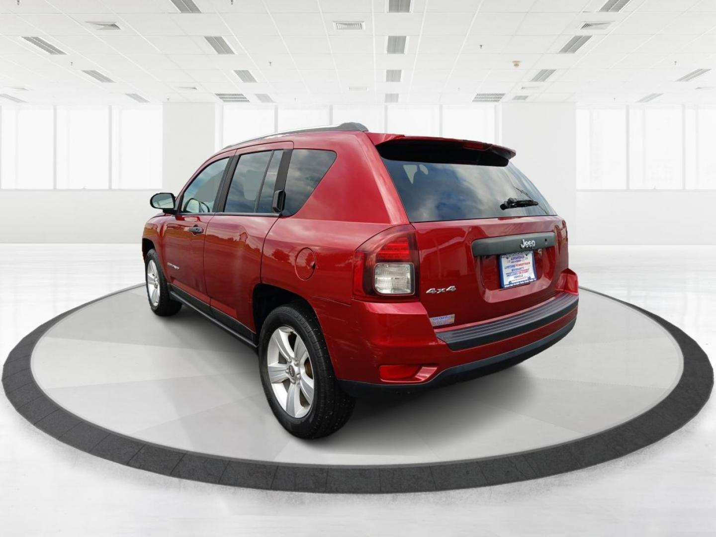 2014 Dp Cherry Red Crystal PC Jeep Compass Sport 4WD (1C4NJDBBXED) with an 2.4L L4 DOHC 16V engine, located at 1951 S Dayton Lakeview Rd., New Carlisle, OH, 45344, (937) 908-9800, 39.890999, -84.050255 - Photo#4