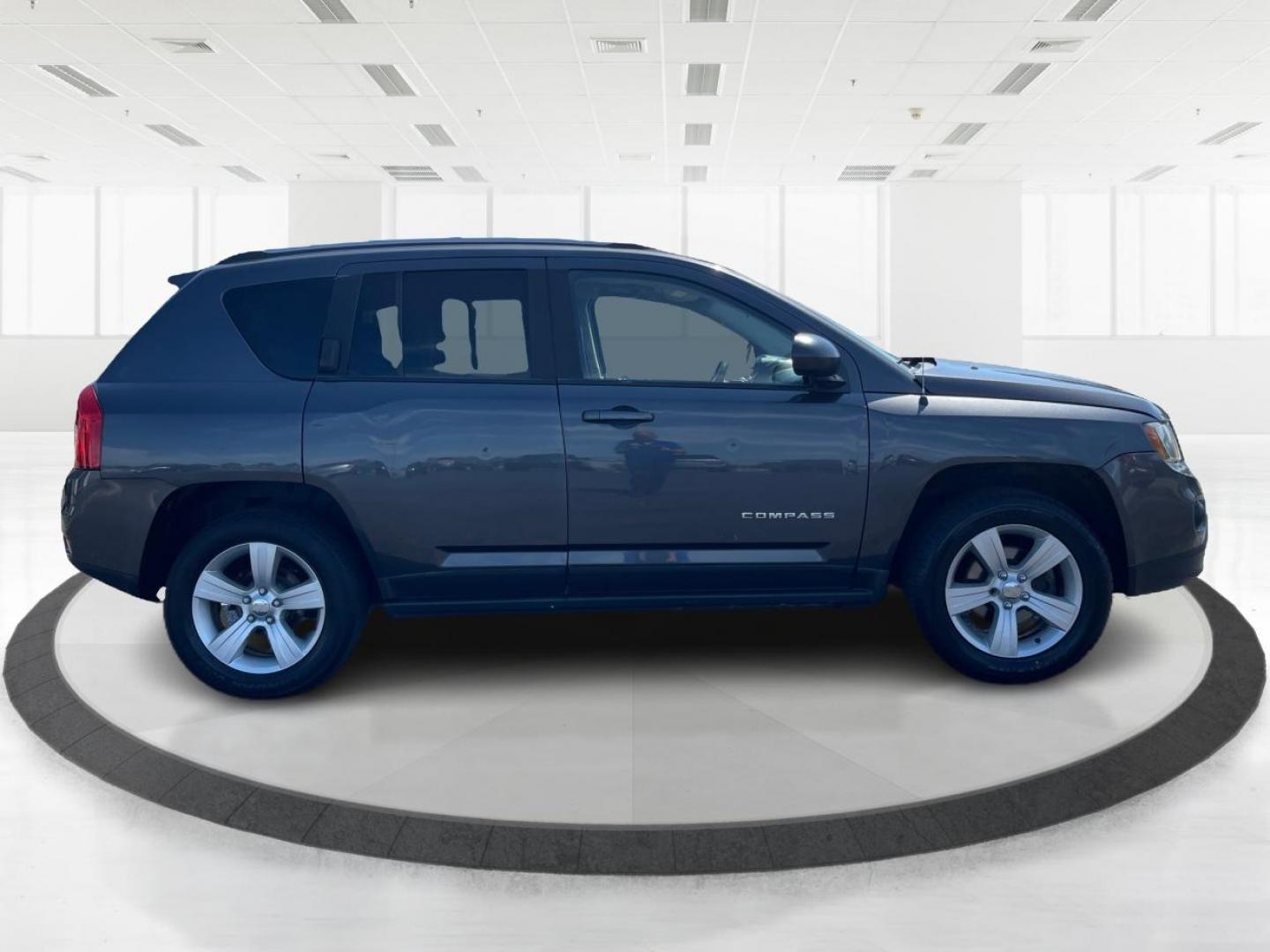 2014 Granite Crystal Met CC Jeep Compass (1C4NJDBBXED) with an 2.4L L4 DOHC 16V engine, located at 401 Woodman Dr, Riverside, OH, 45431, (937) 908-9800, 39.760899, -84.123421 - Photo#1